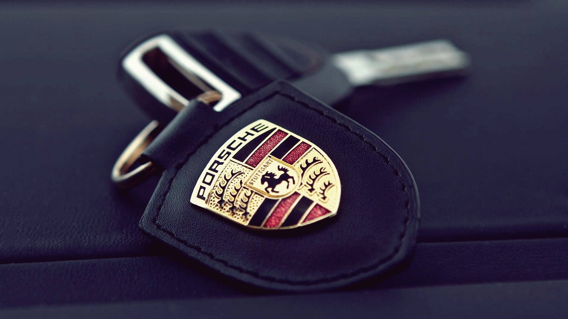 Porsche car key with emblem HD Wallpaper