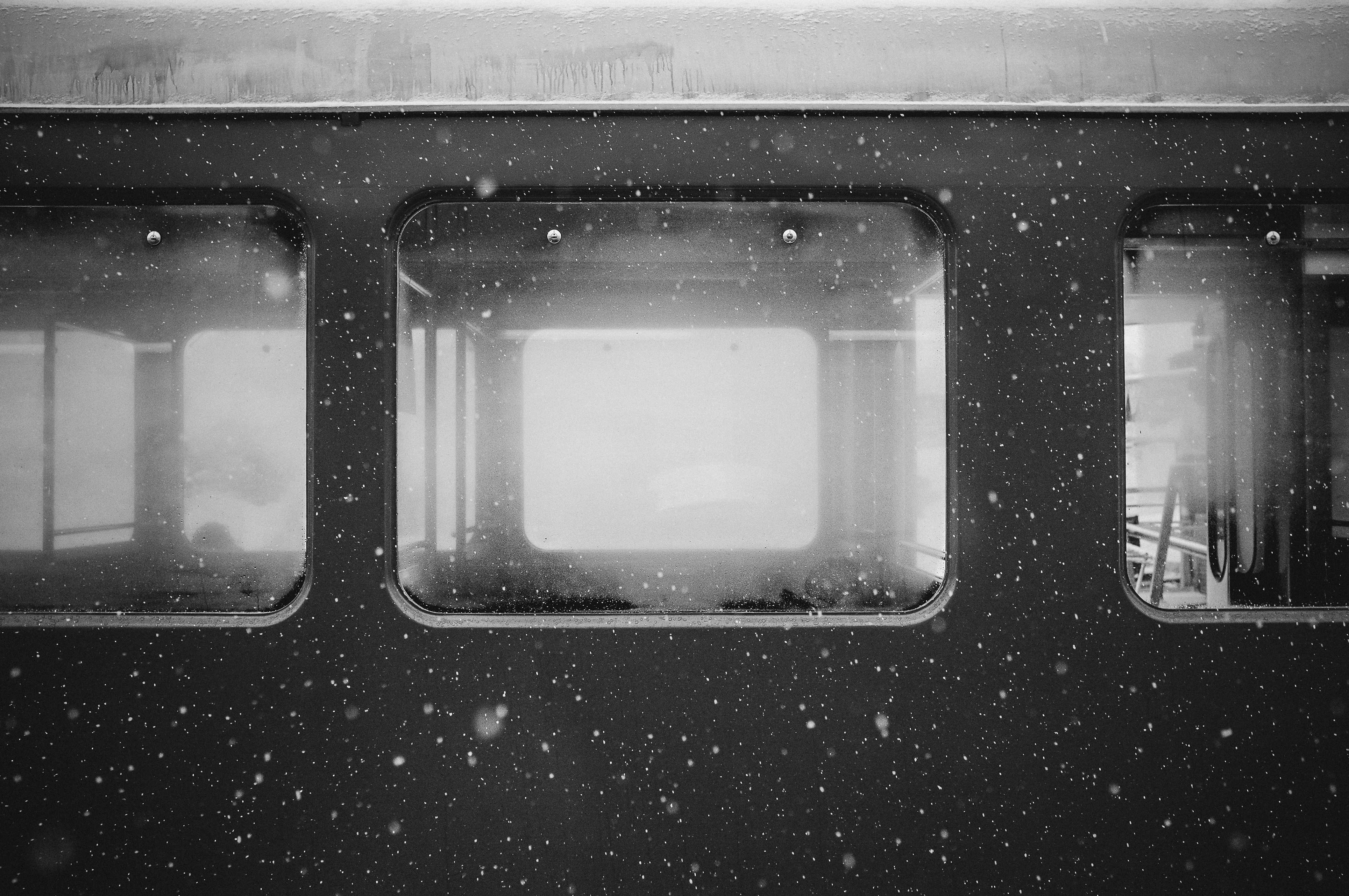 Train windows with falling snow HD Wallpaper