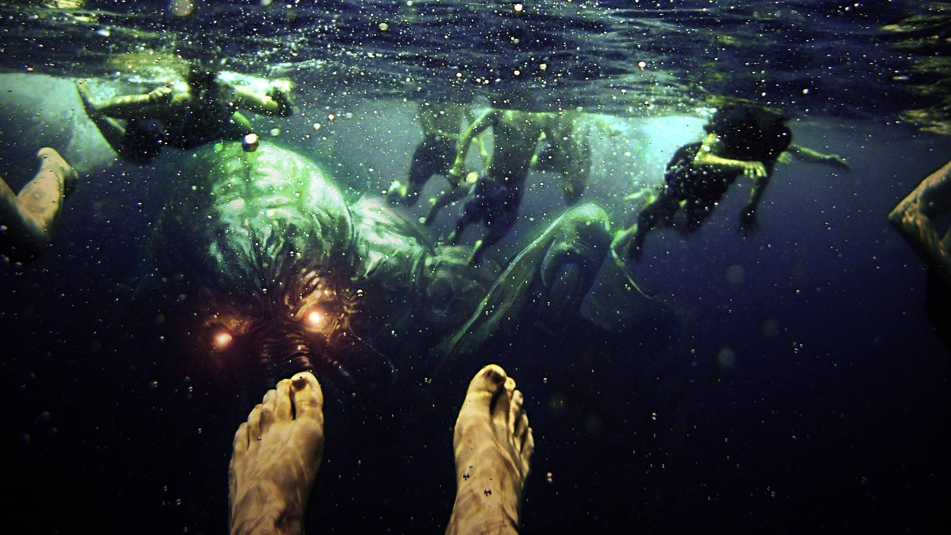 Cthulhu attacks swimmers underwater HD Wallpaper