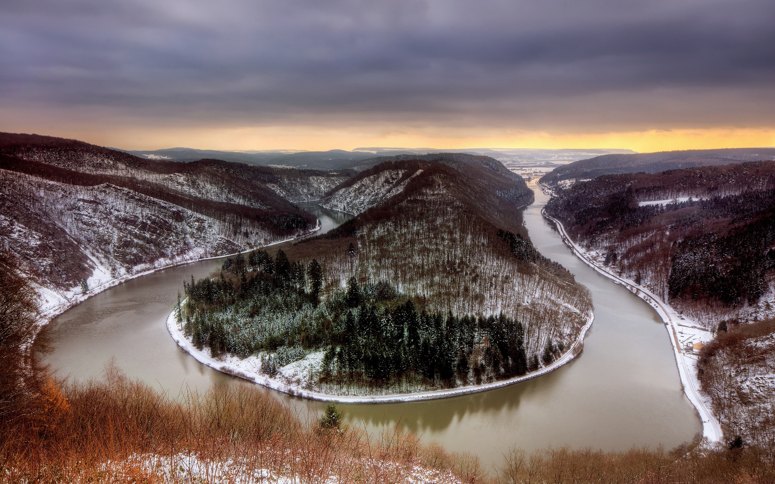 River bend in a snowy forest landscape HD Wallpaper