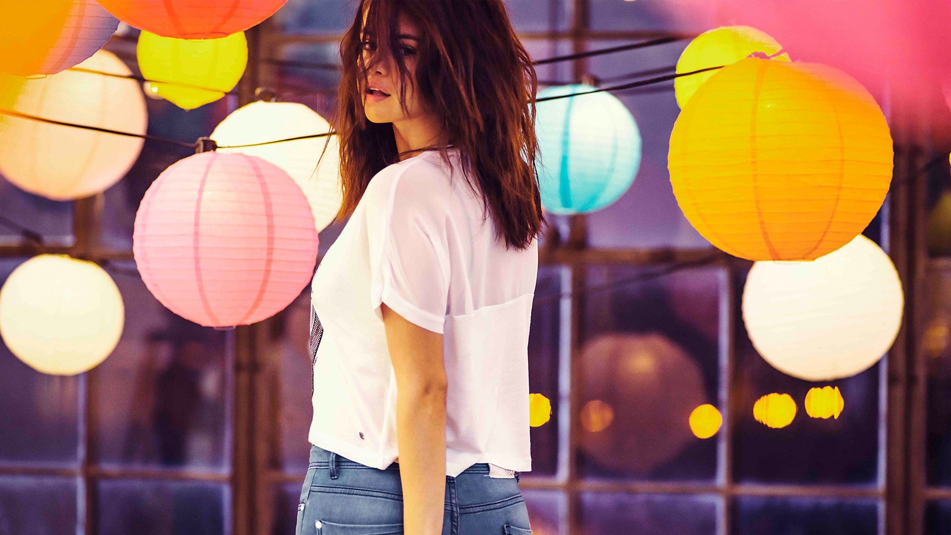 Selena Gomez posing with colorful lanterns HD Wallpaper