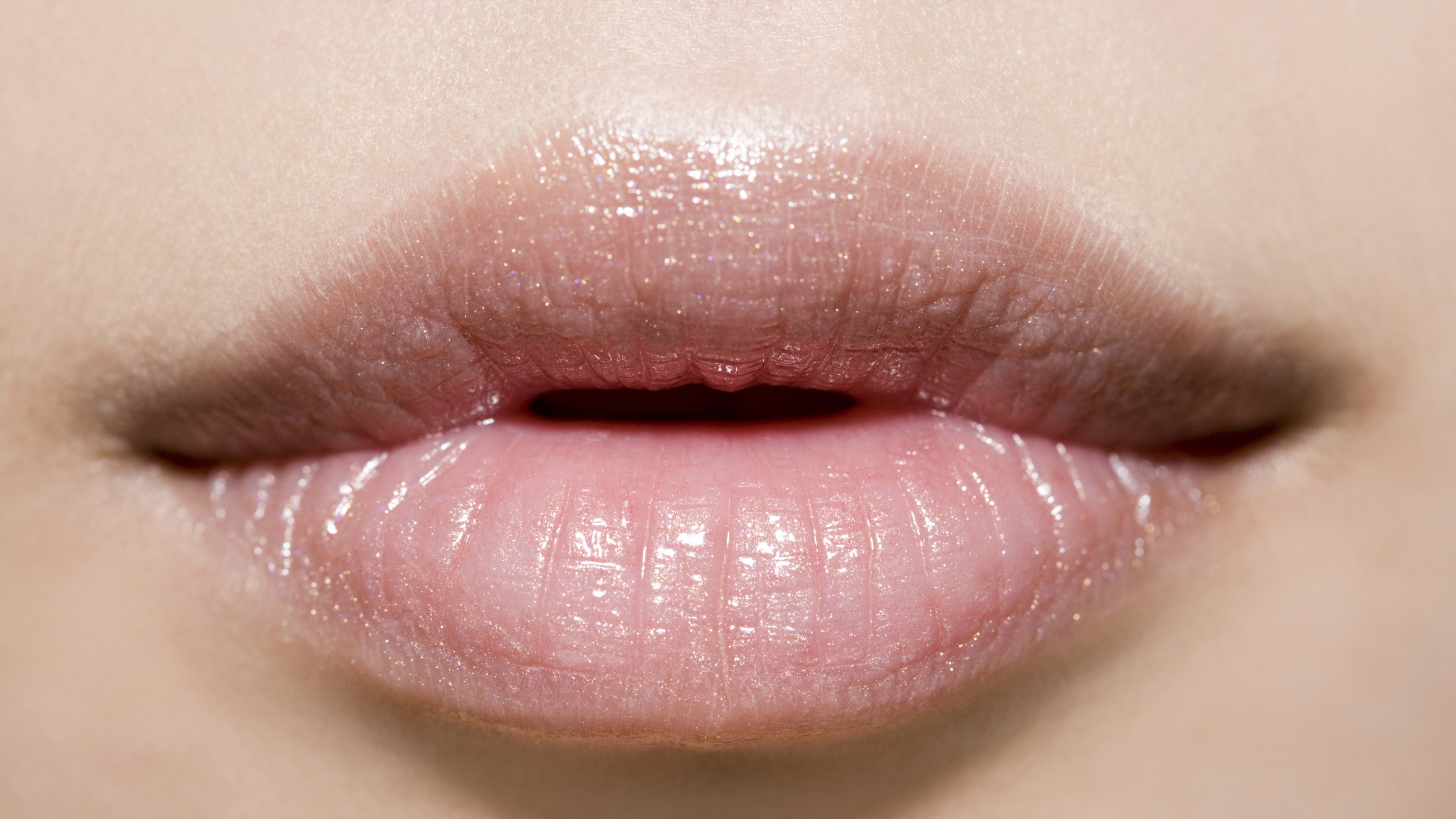 Close-up of a woman's lips with lip gloss HD Wallpaper