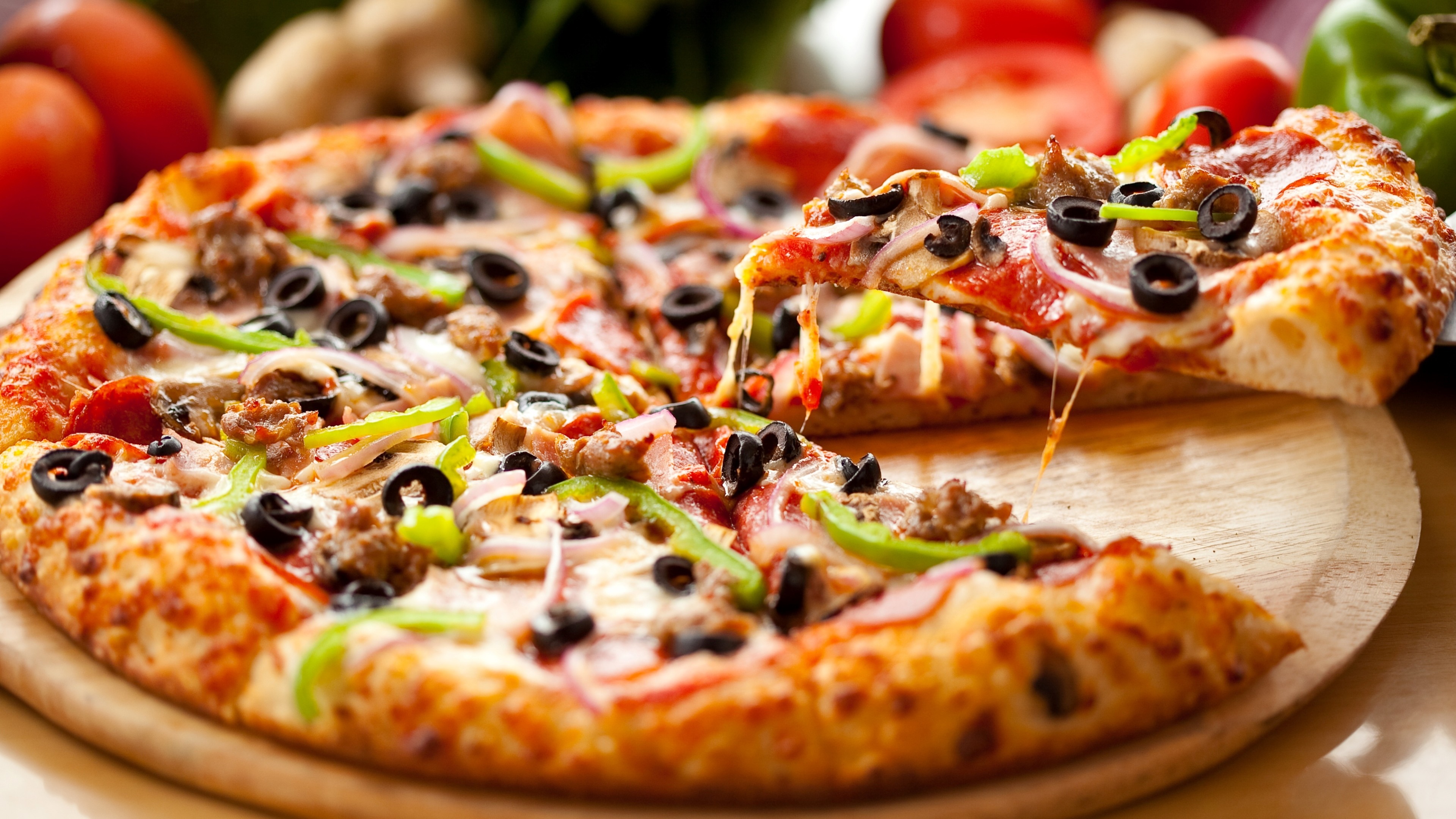 A delicious pizza with various toppings HD Wallpaper
