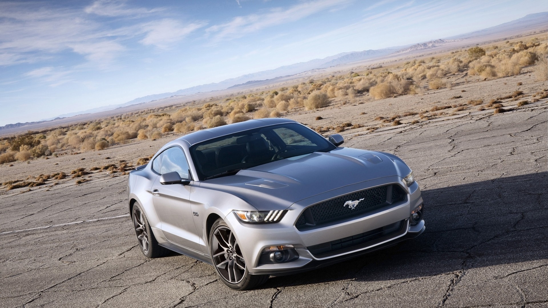 2015 Ford Mustang GT in a desert landscape HD Wallpaper