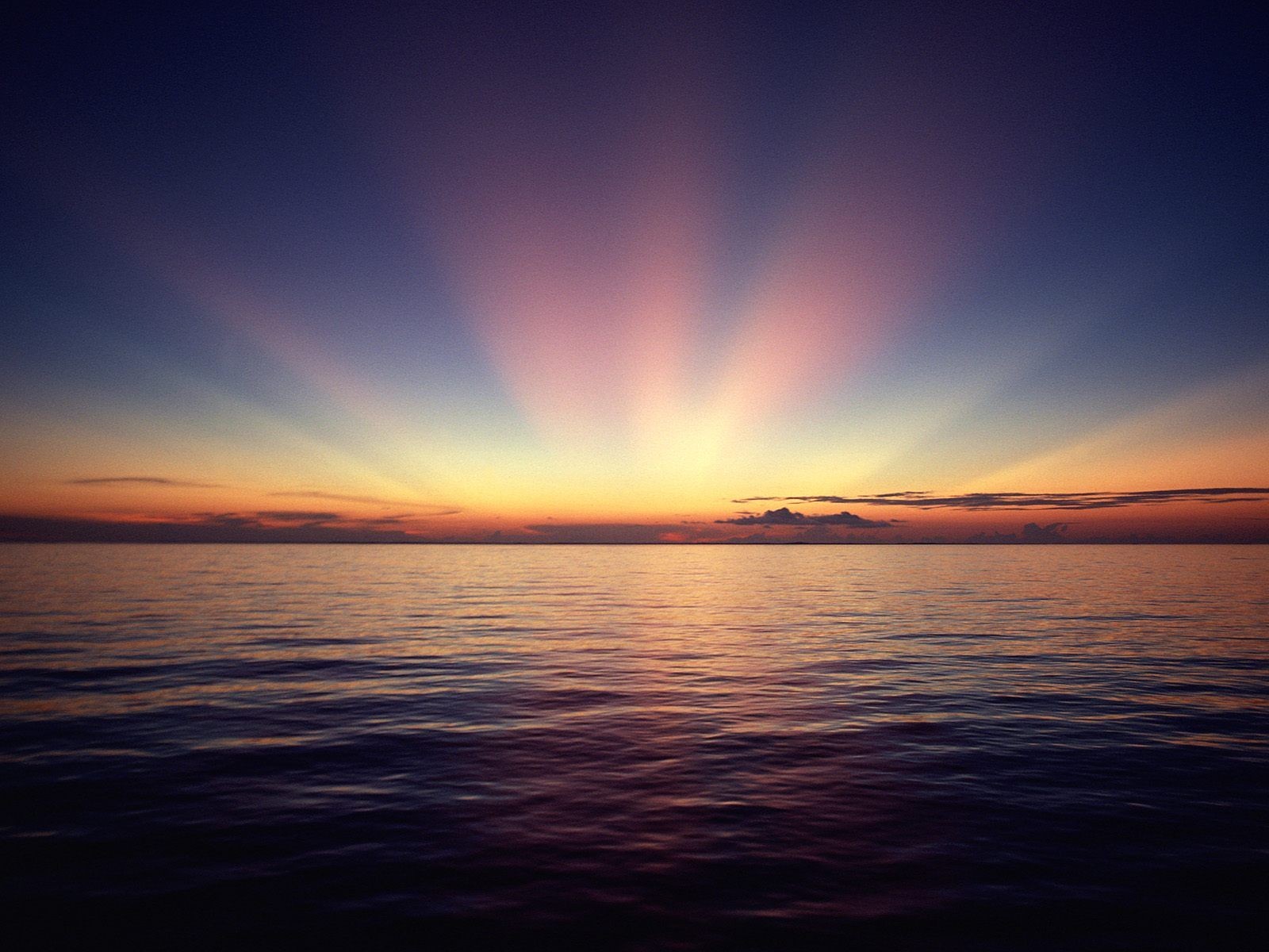Sunset over the ocean with crepuscular rays HD Wallpaper