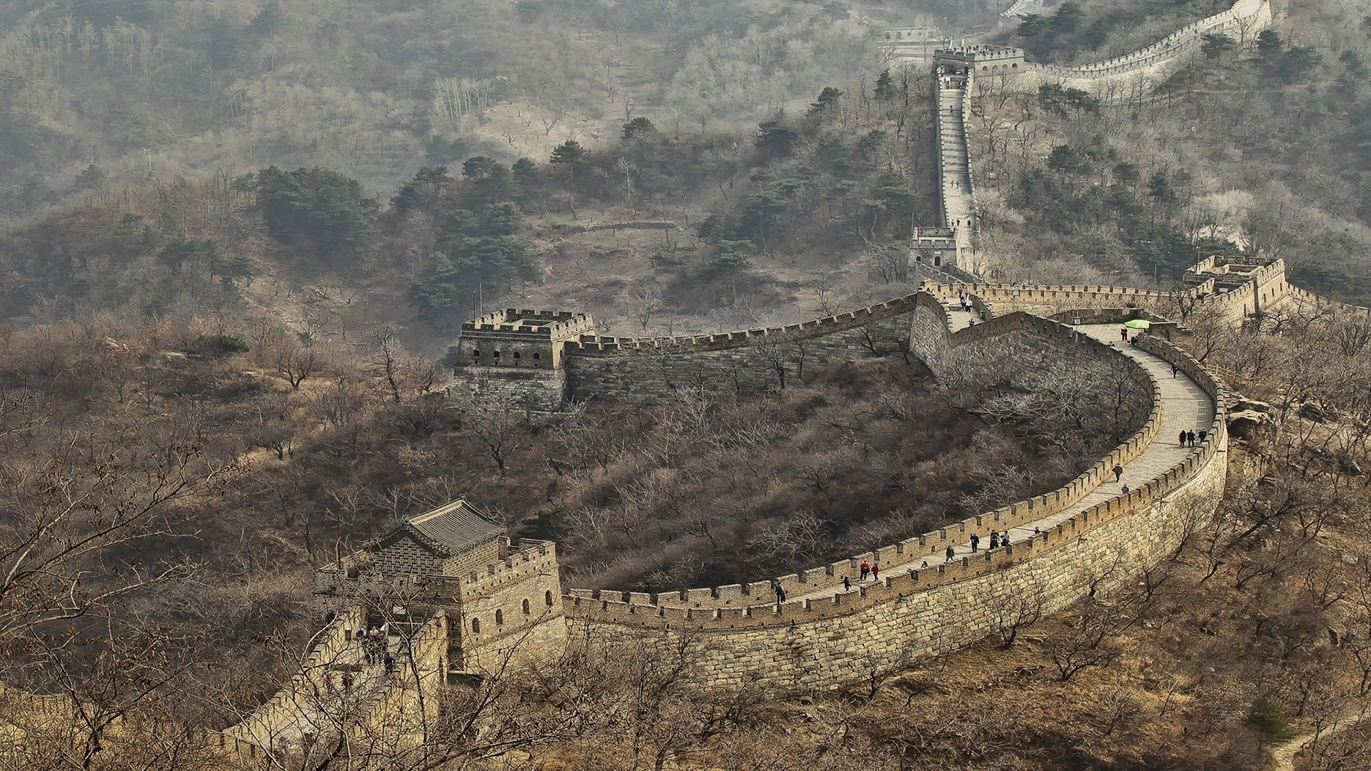 The Great Wall of China winding through a mountainous landscape HD Wallpaper