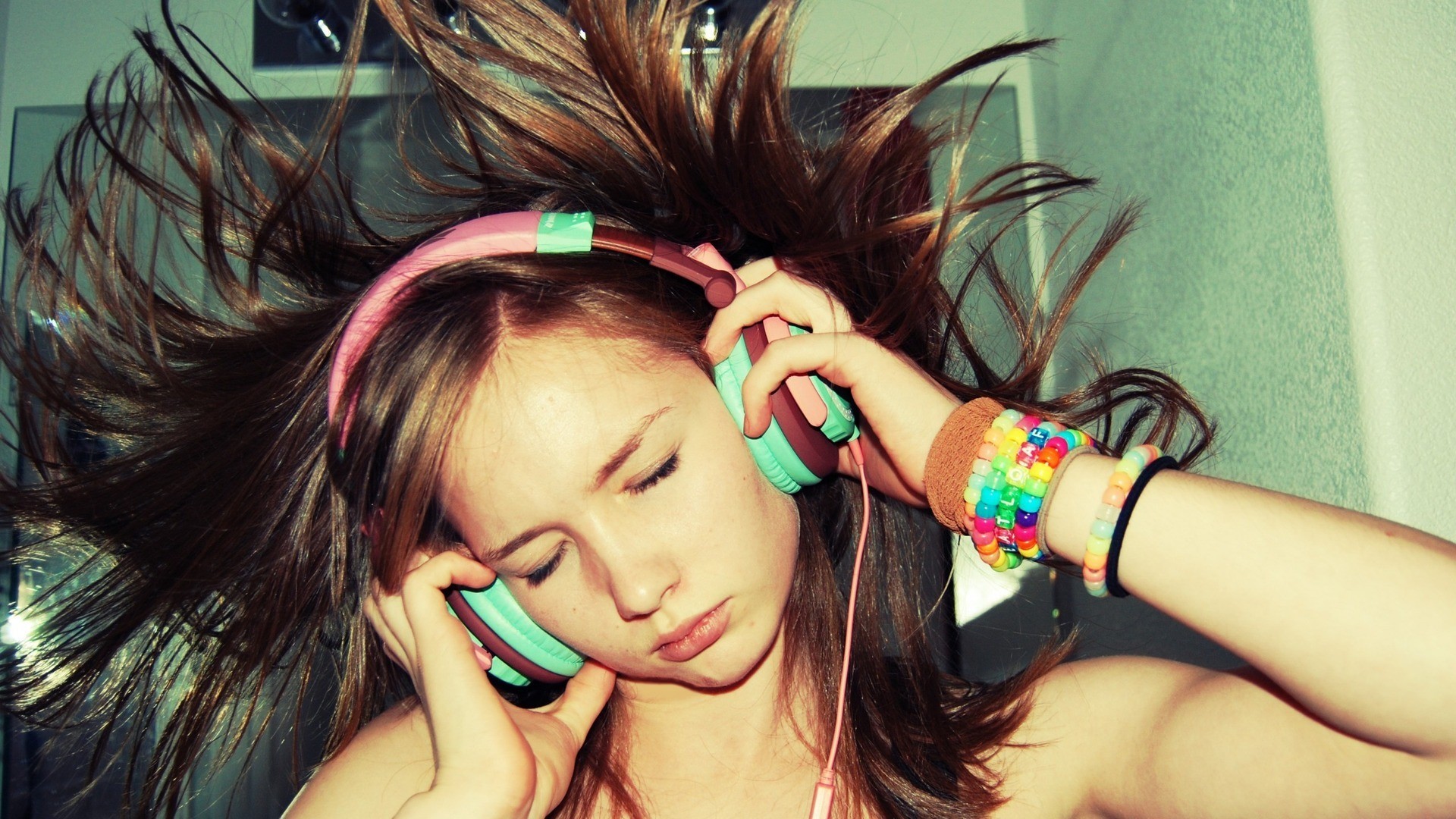 Woman with headphones and flying hair HD Wallpaper
