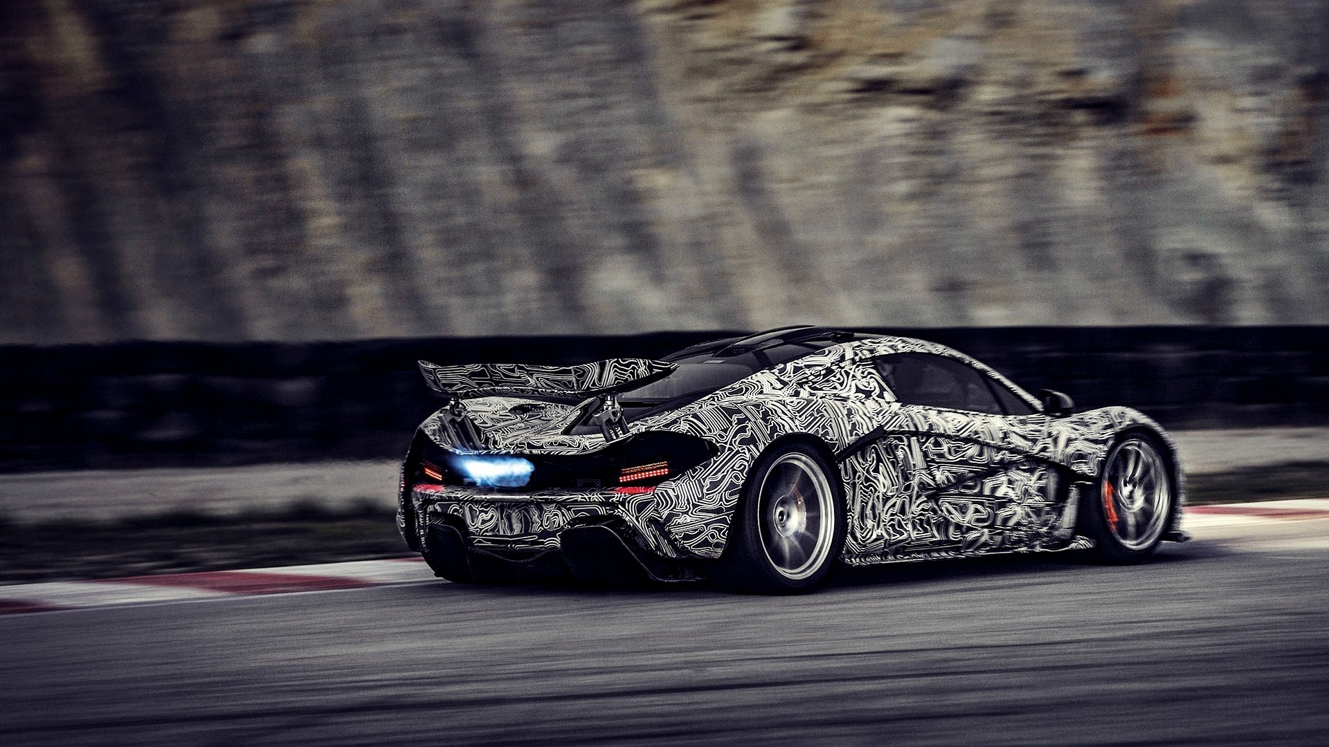 McLaren P1 camouflage on a race track HD Wallpaper