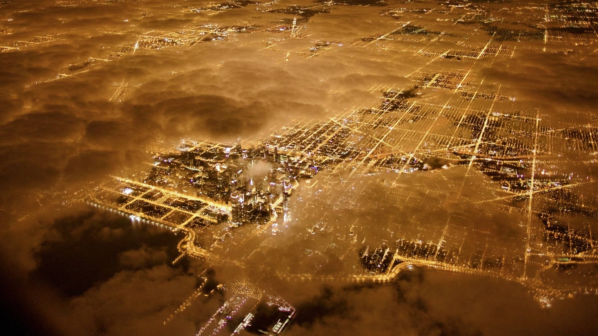 Aerial view of Chicago at night through clouds HD Wallpaper