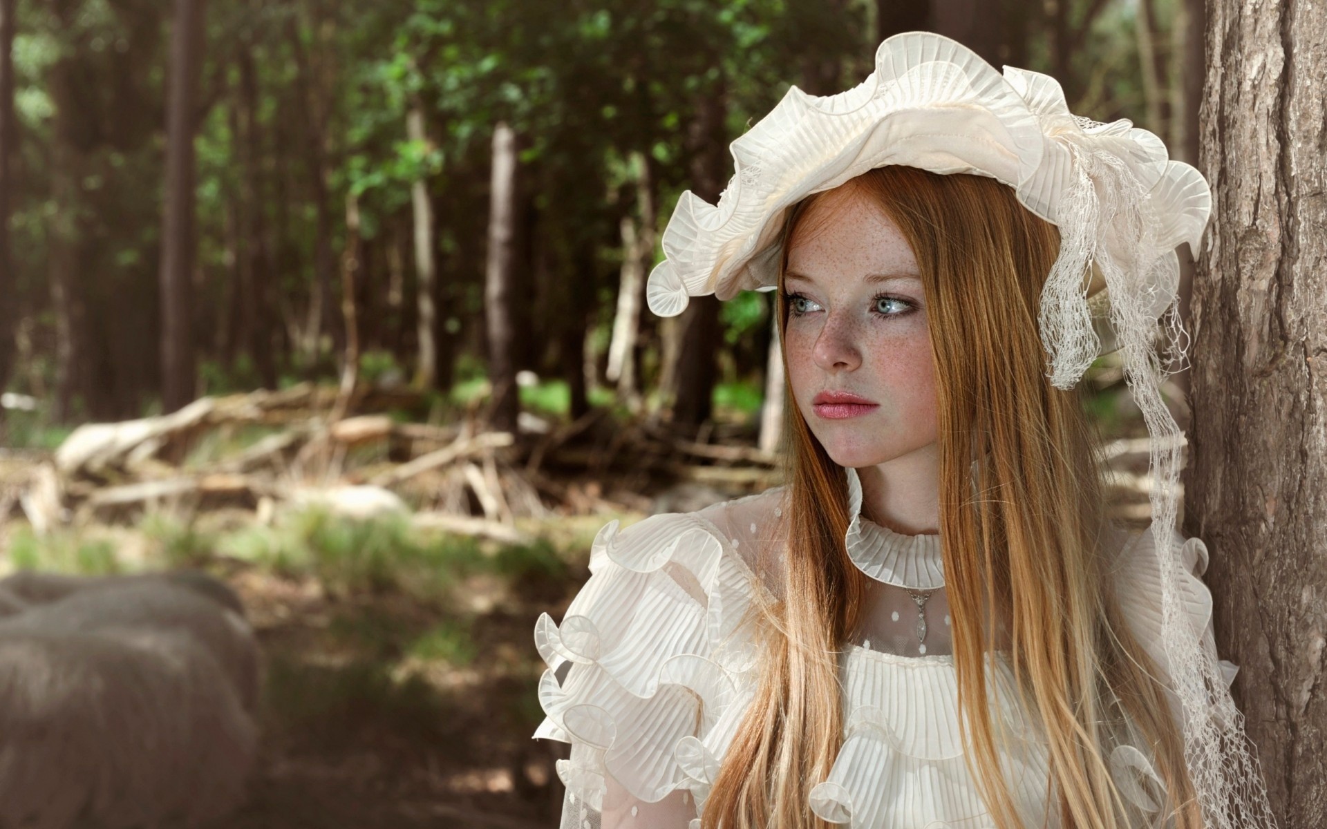 Redhead woman with freckles in a white dress in the forest HD Wallpaper