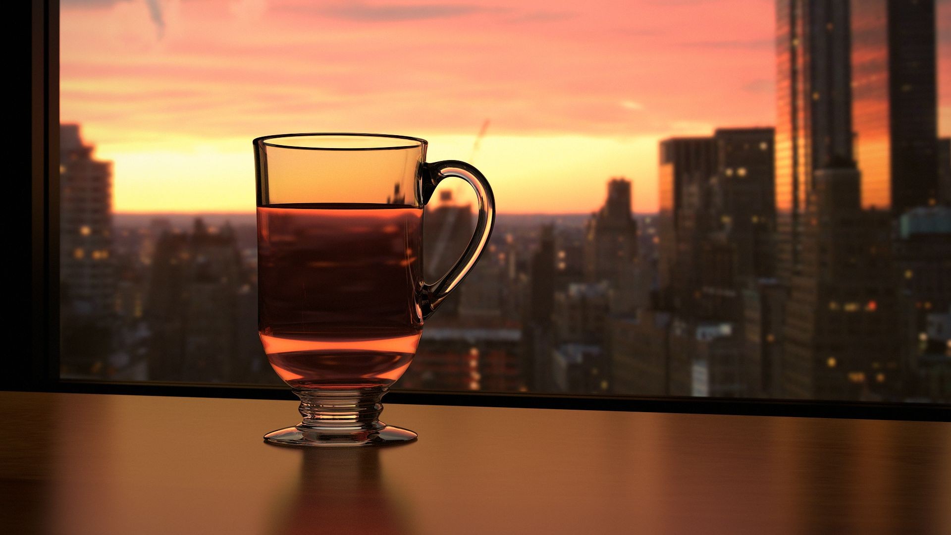 Glass of tea overlooking a city at sunset HD Wallpaper