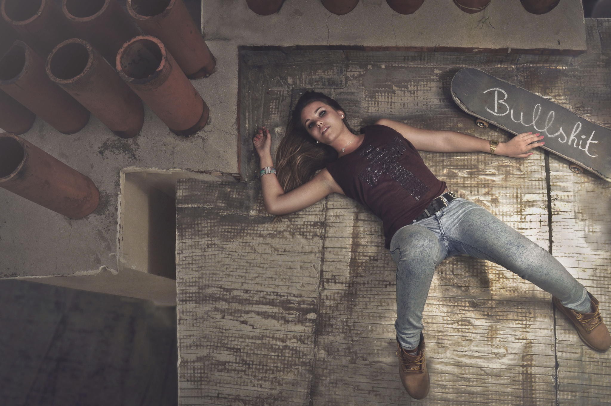 Woman lying on the floor with a skateboard HD Wallpaper