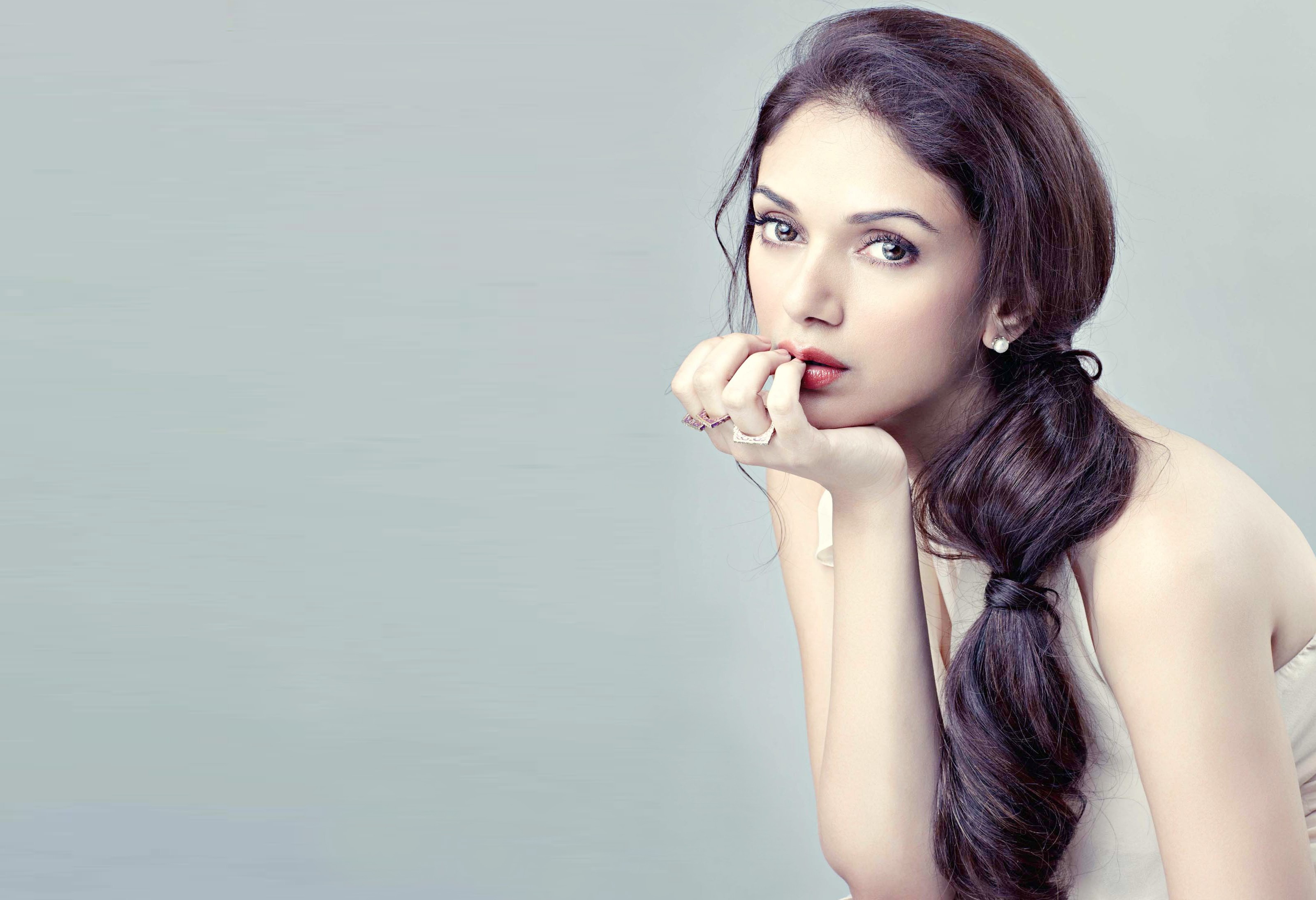 Woman with long dark hair and rings HD Wallpaper