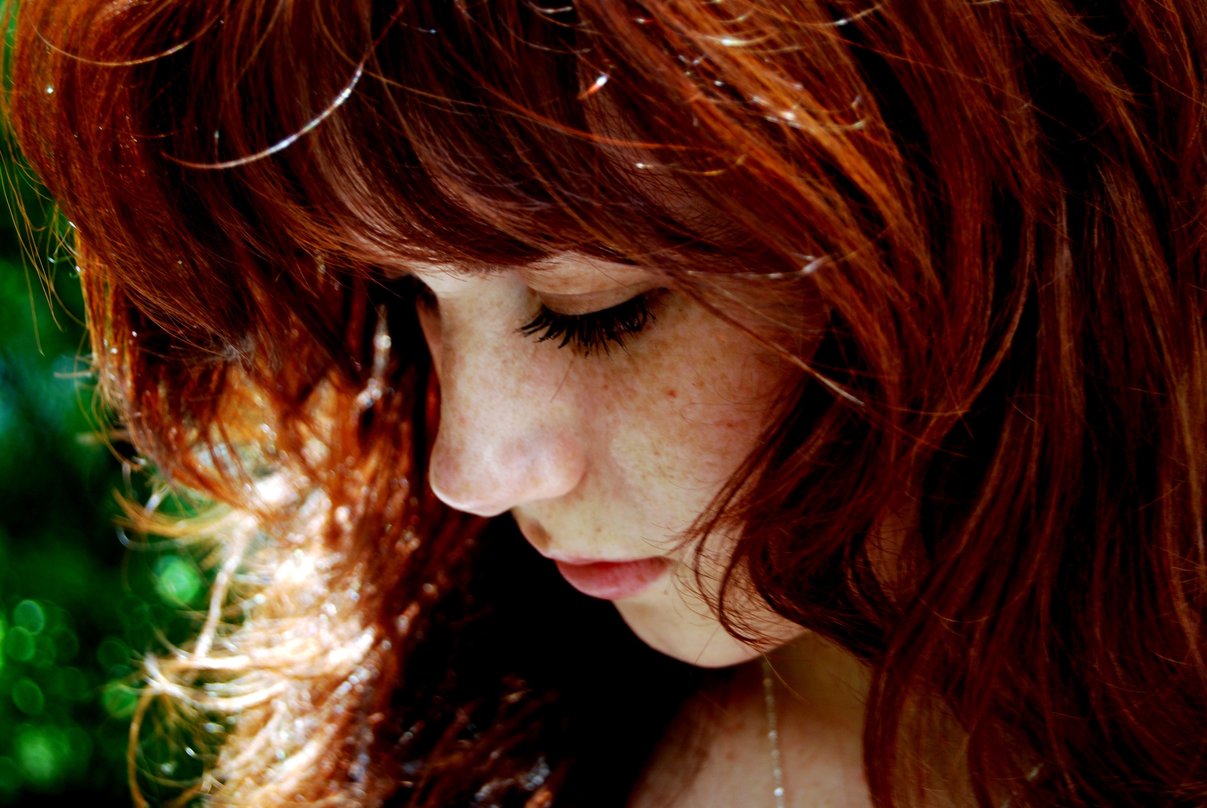 Close-up of a young woman with red hair and freckles HD Wallpaper