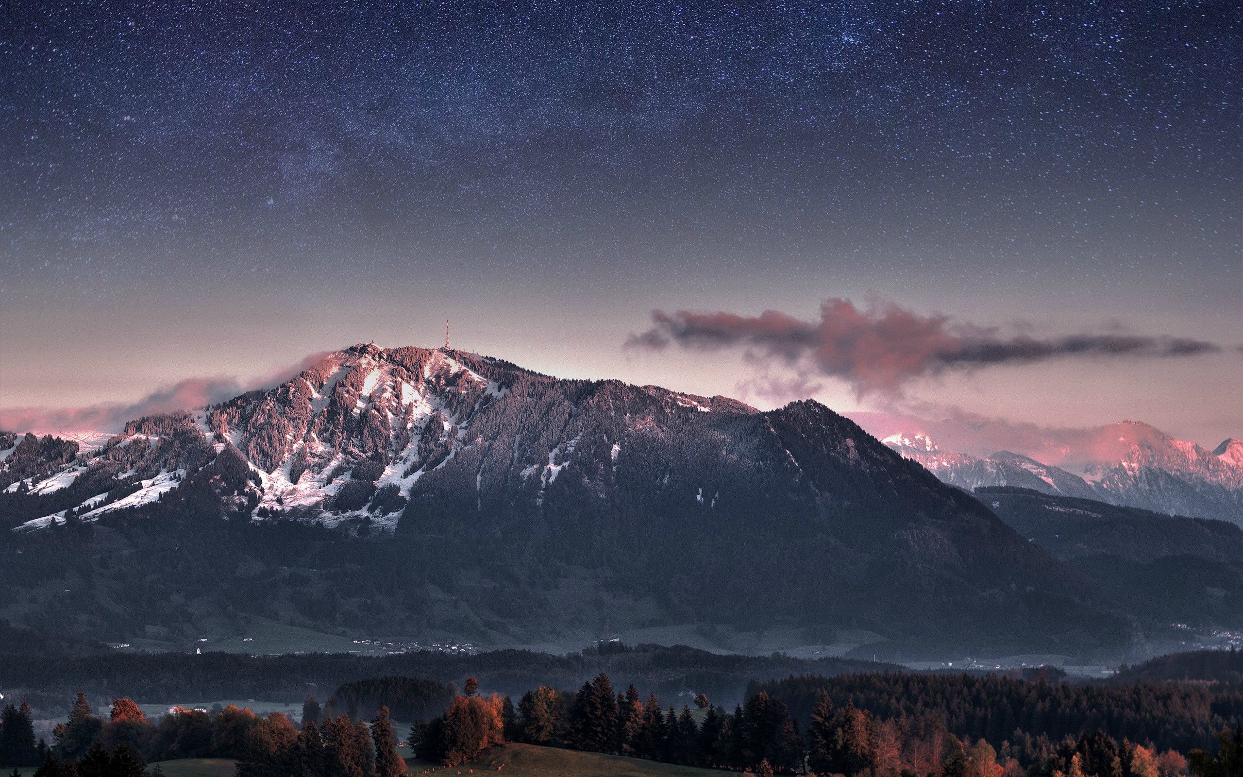 Starry night over snow-capped mountains HD Wallpaper