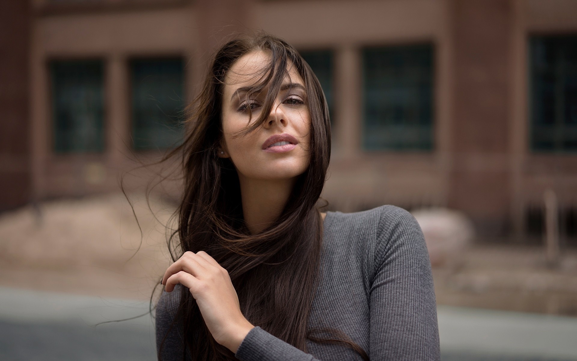 Woman with long brown hair outdoors HD Wallpaper
