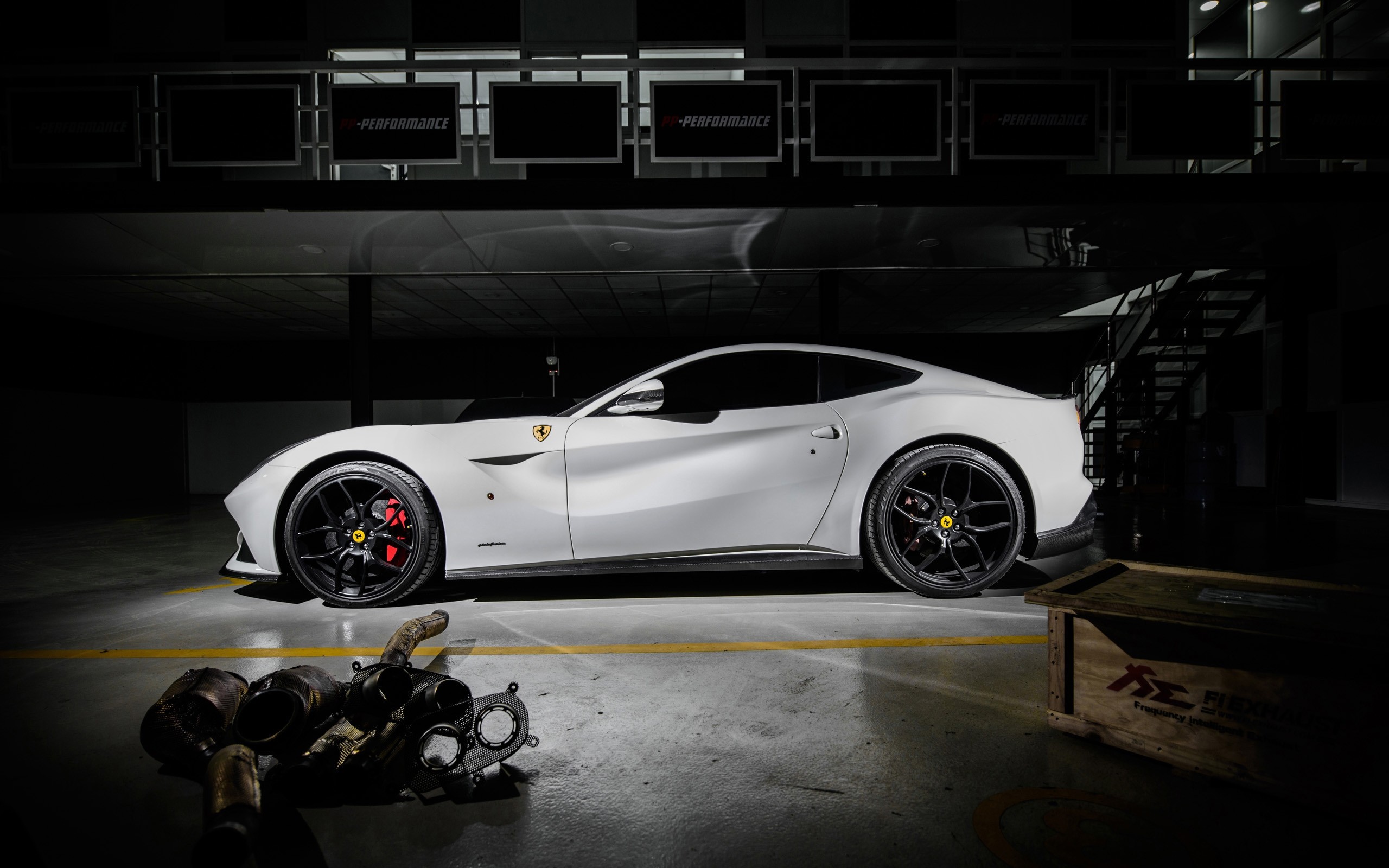 White Ferrari F12berlinetta in a garage HD Wallpaper