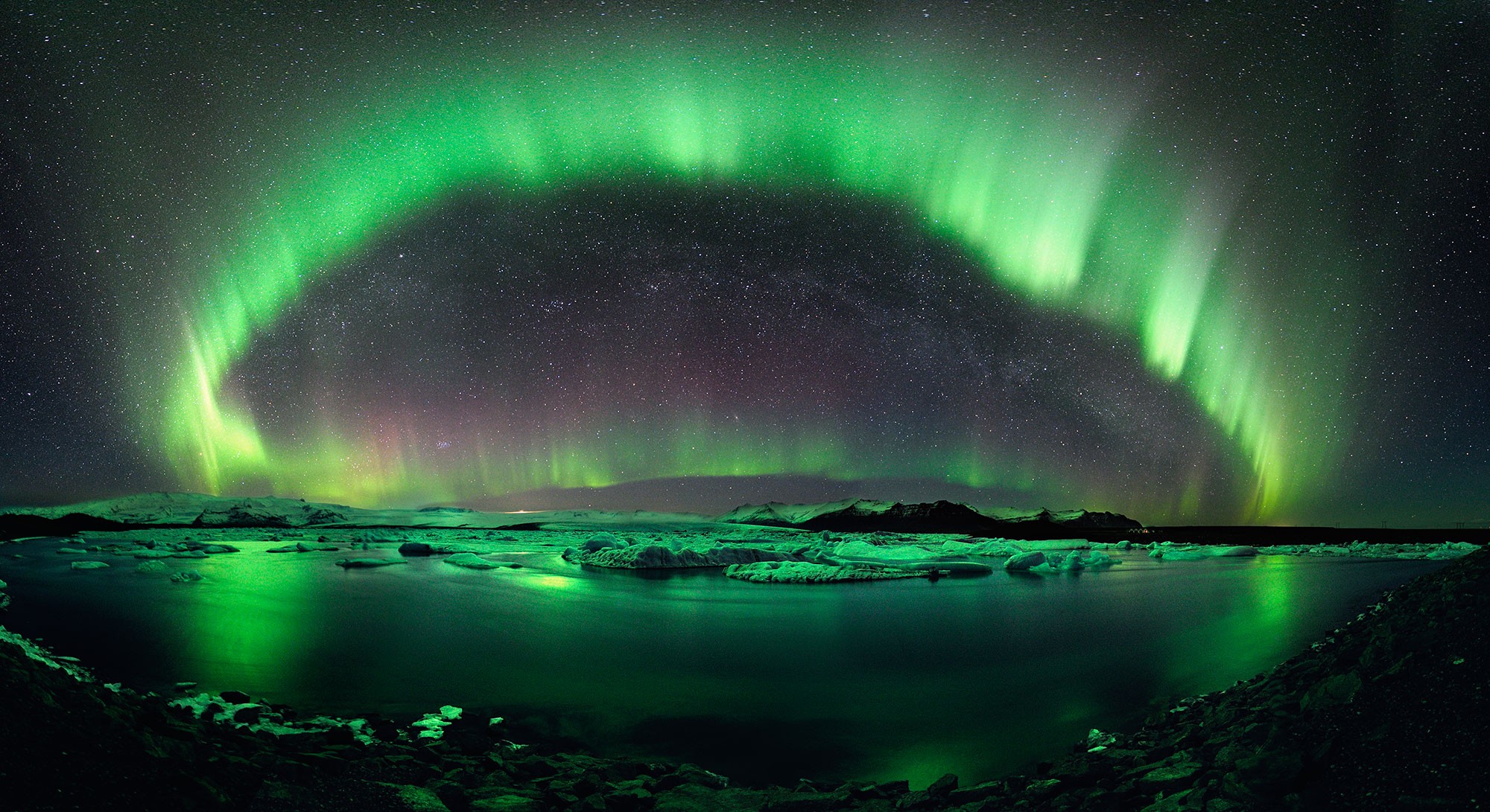 Aurora Borealis over a glacial lake in Iceland HD Wallpaper