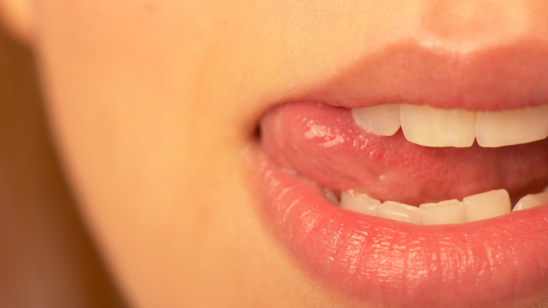 Close-up of a woman's lips and tongue HD Wallpaper