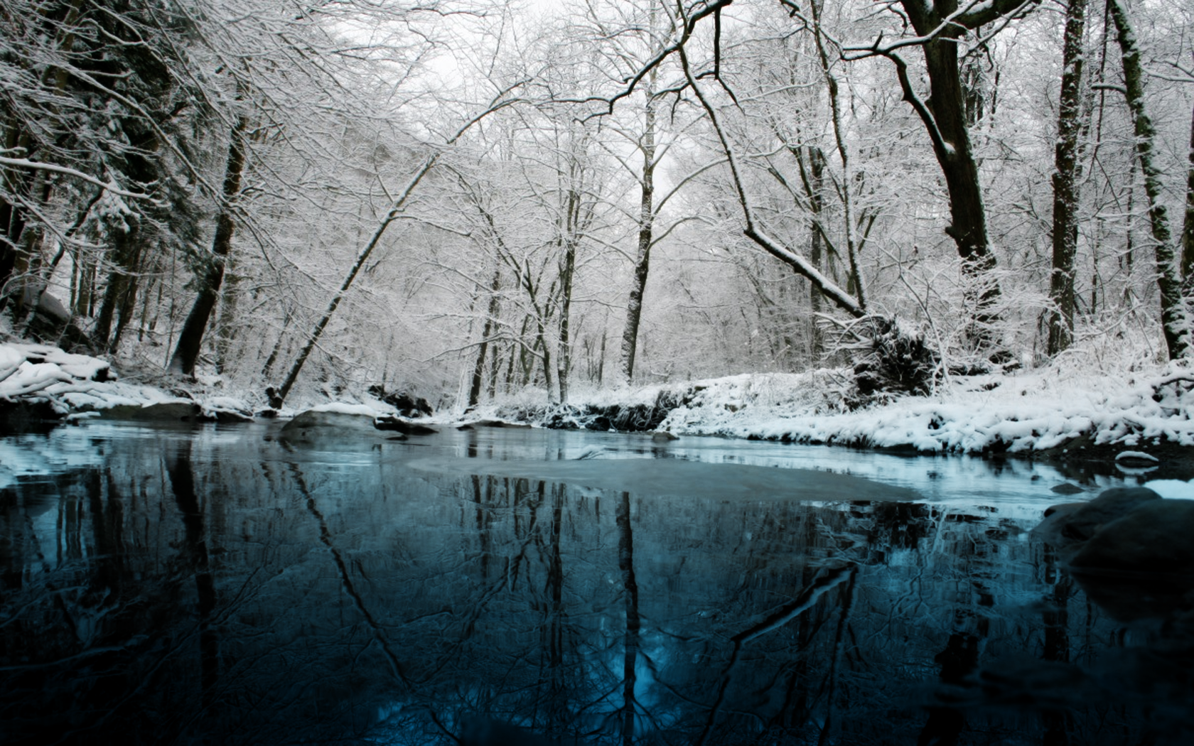 Snowy forest with a river and reflections HD Wallpaper