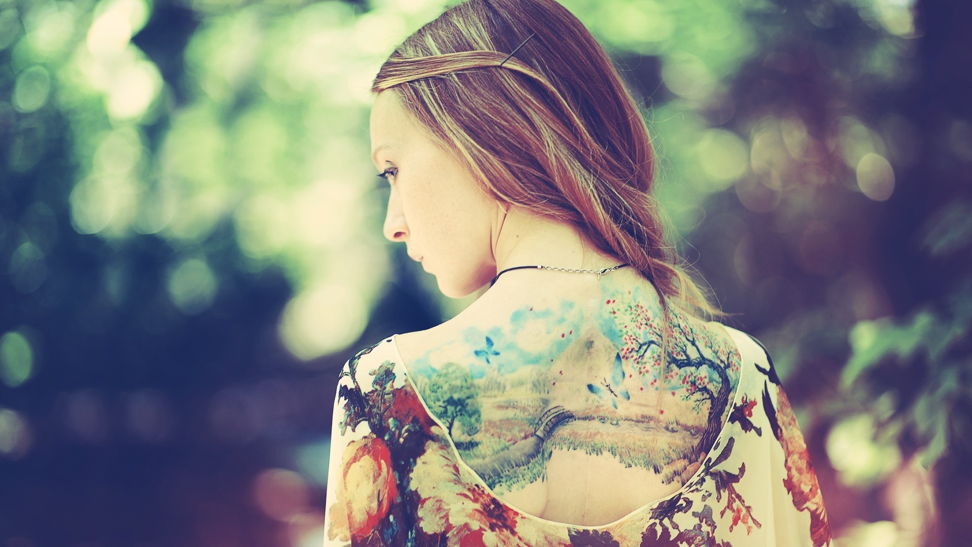 Woman with a large landscape tattoo on her back HD Wallpaper