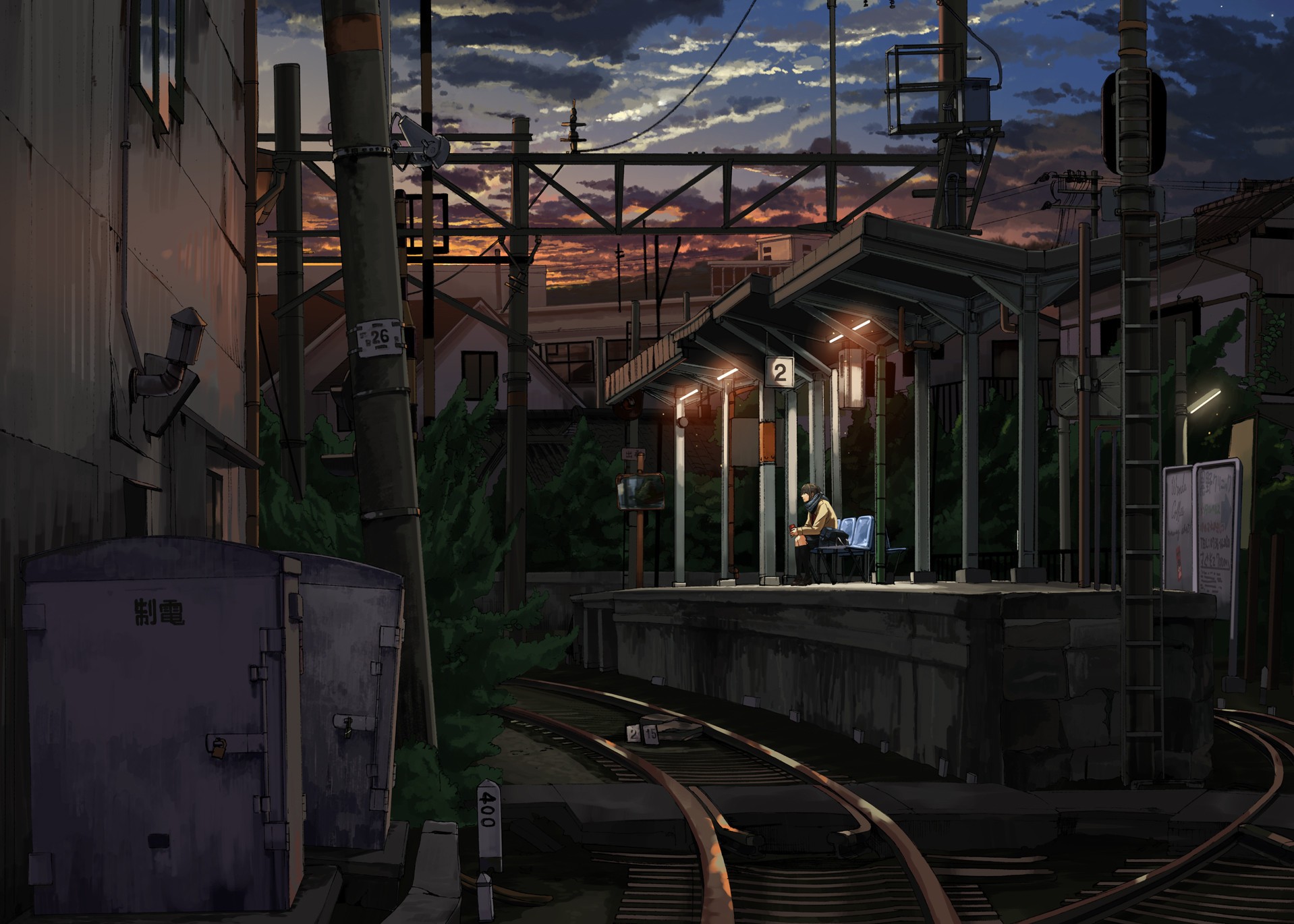Train station at dusk with a lone figure waiting HD Wallpaper