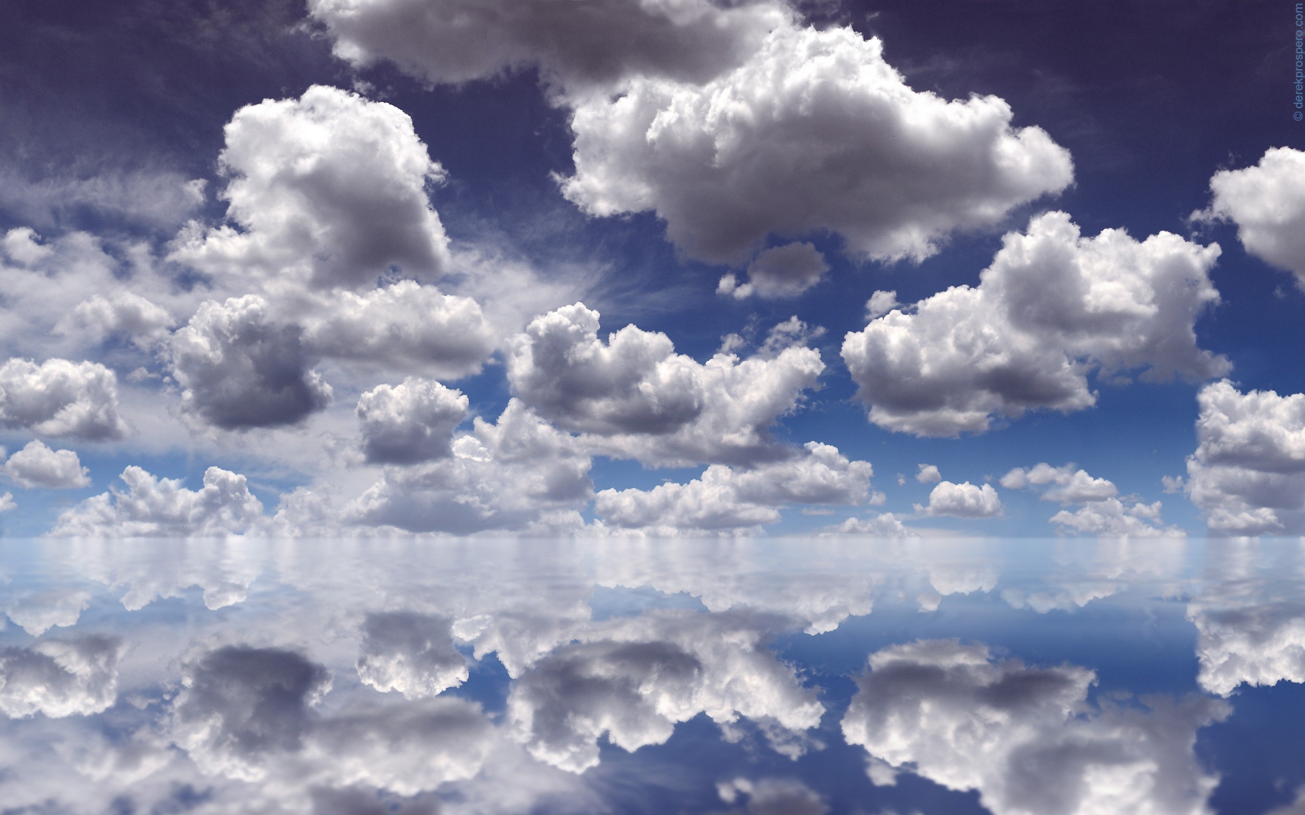 Clouds reflected in water under a blue sky HD Wallpaper