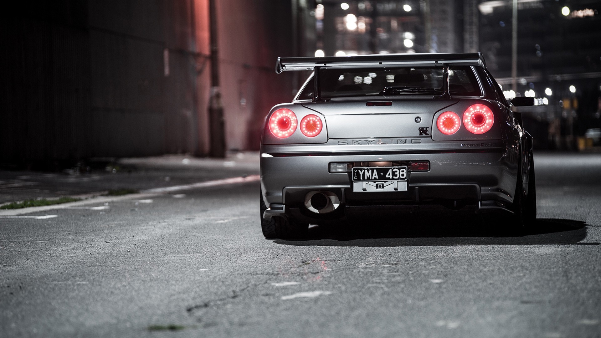 Nissan Skyline GT-R R34 rear view at night HD Wallpaper