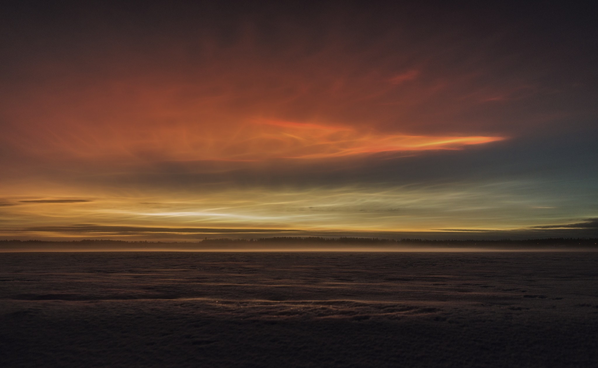 Noctilucent clouds over a snowy landscape HD Wallpaper
