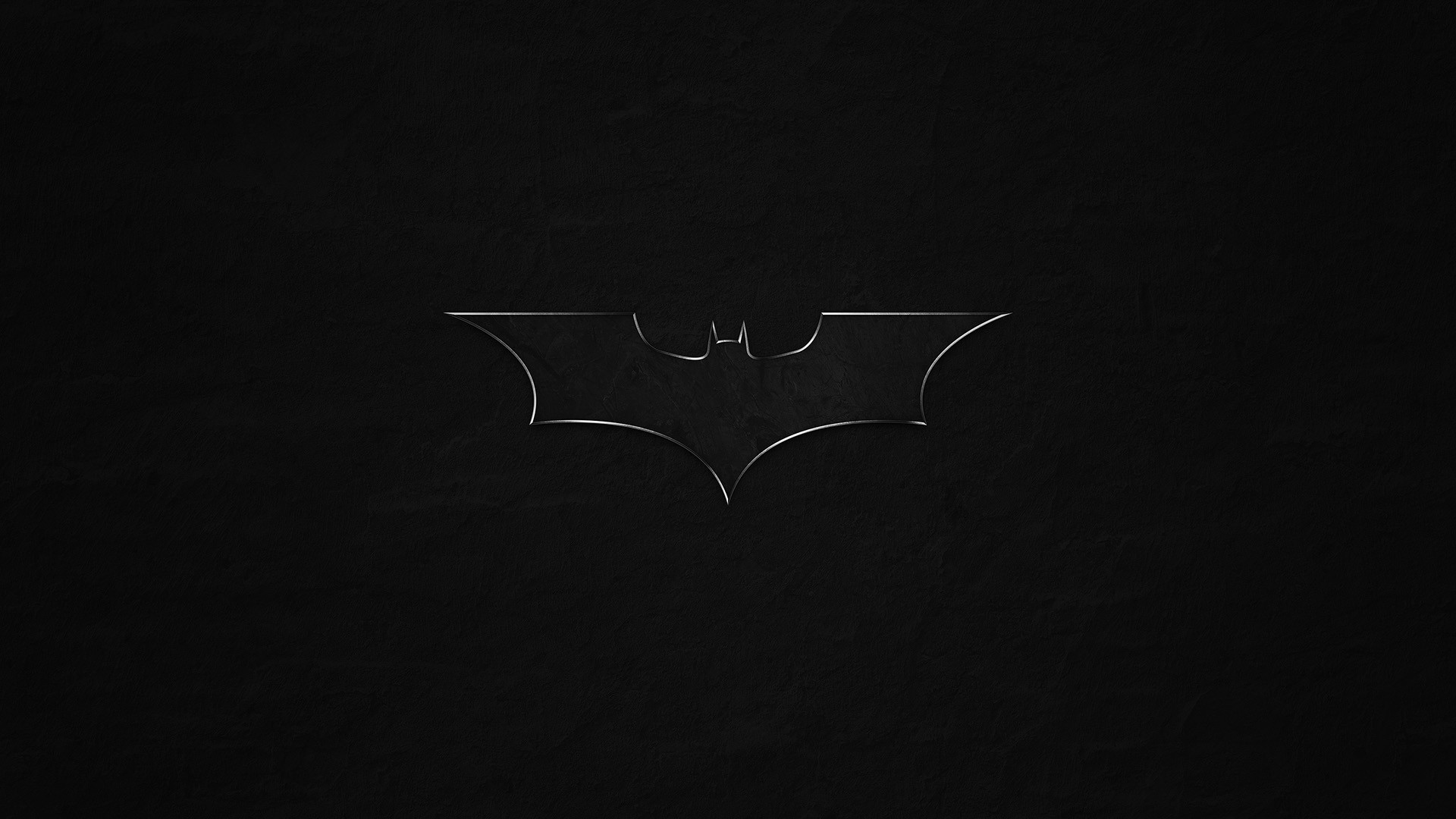 The Batman logo on a dark background HD Wallpaper