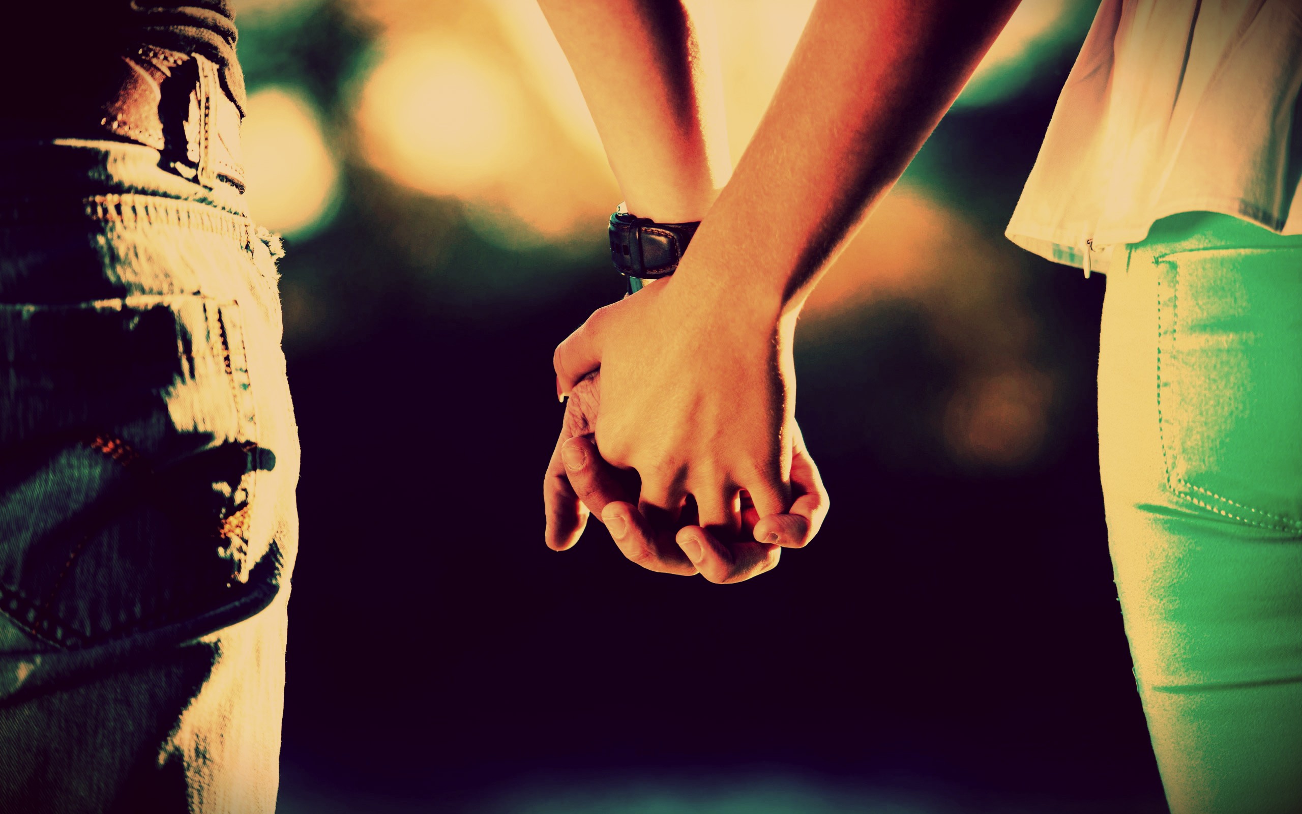 Couple holding hands outdoors at night HD Wallpaper