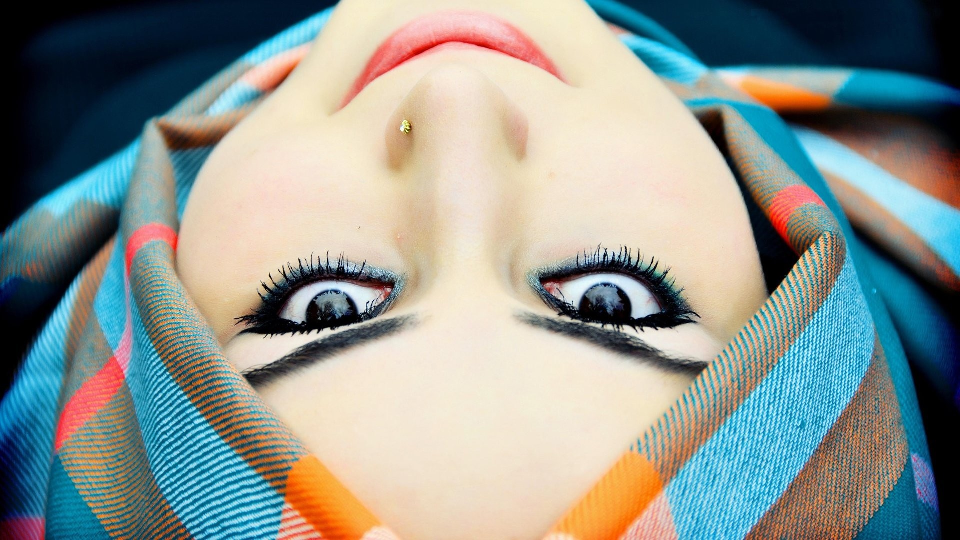 Woman wearing a colorful hijab, upside down HD Wallpaper