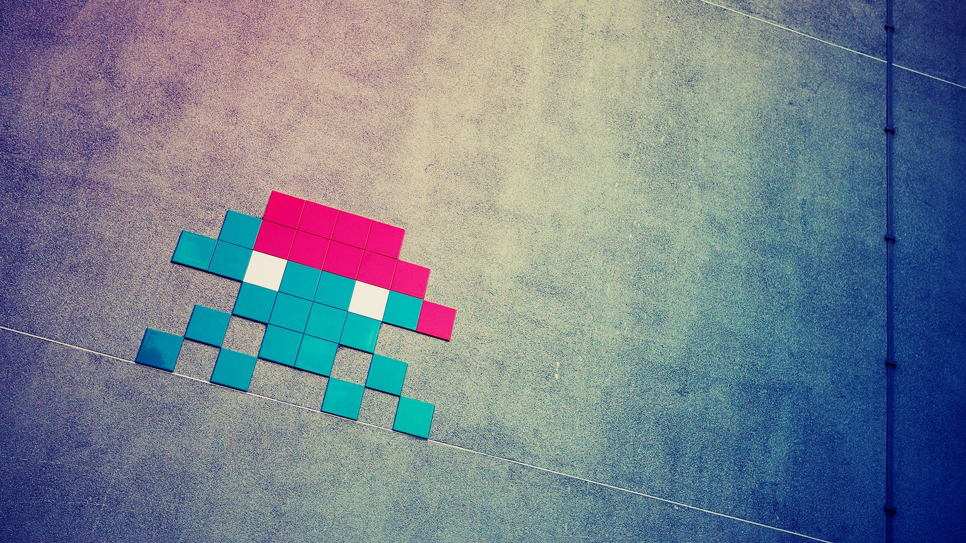Space Invaders pixel art on a textured wall HD Wallpaper