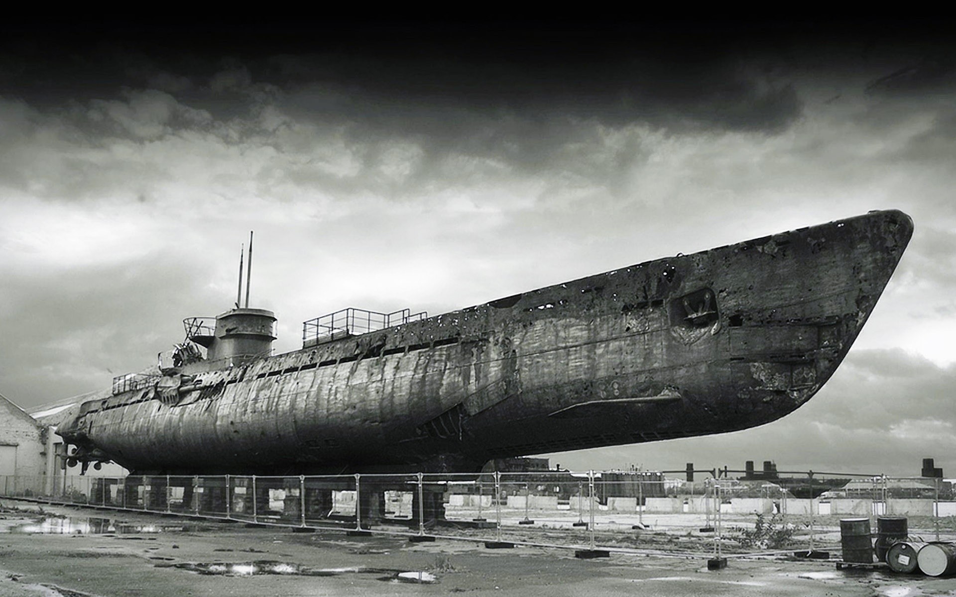 Abandoned submarine on display under a cloudy sky HD Wallpaper