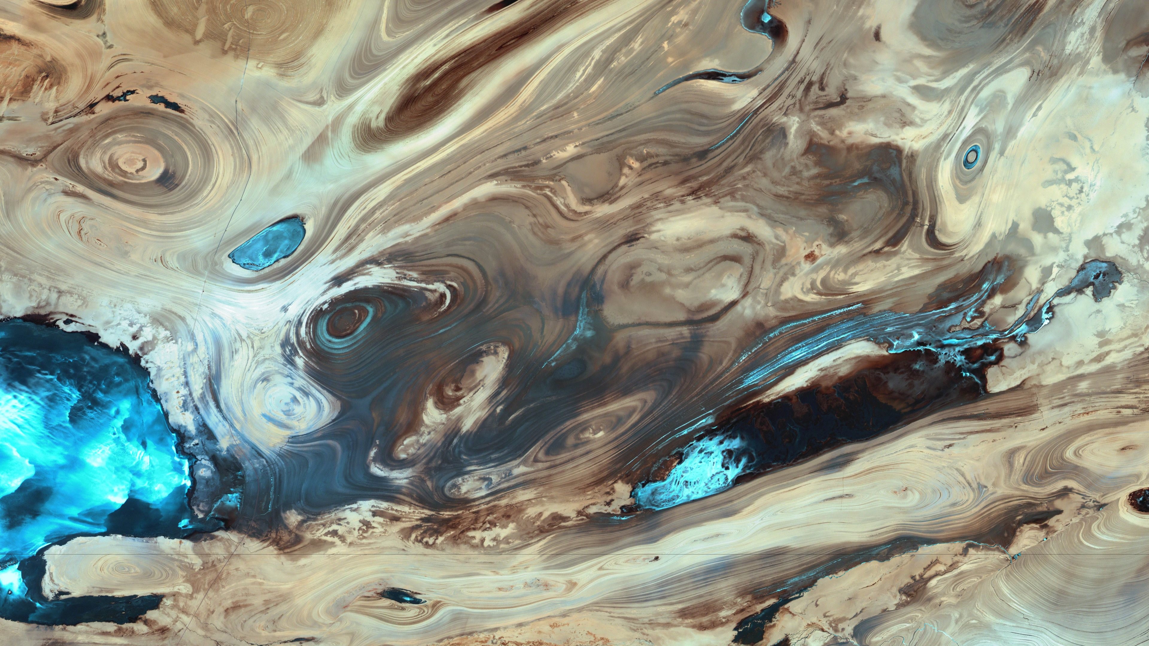 Abstract swirling patterns of desert and water HD Wallpaper