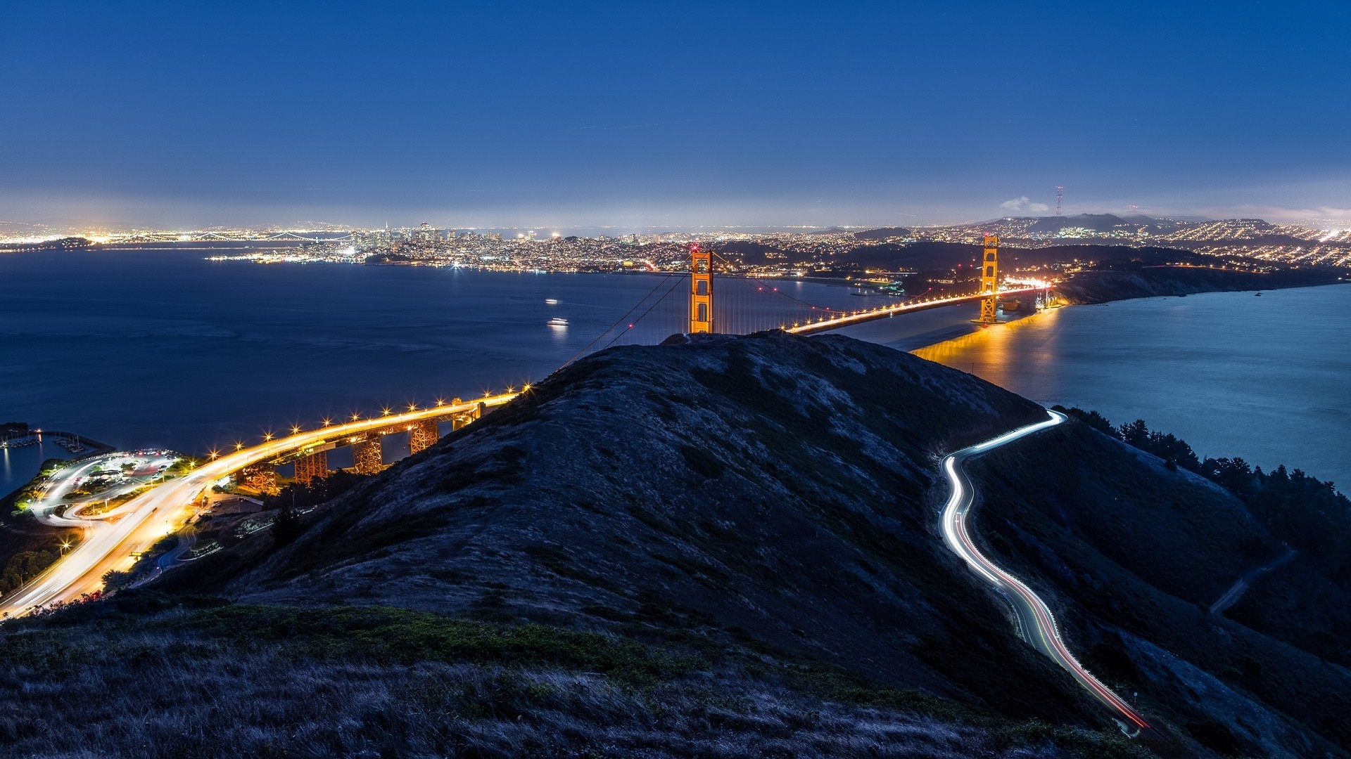 Golden Gate Bridge at night with city lights HD Wallpaper