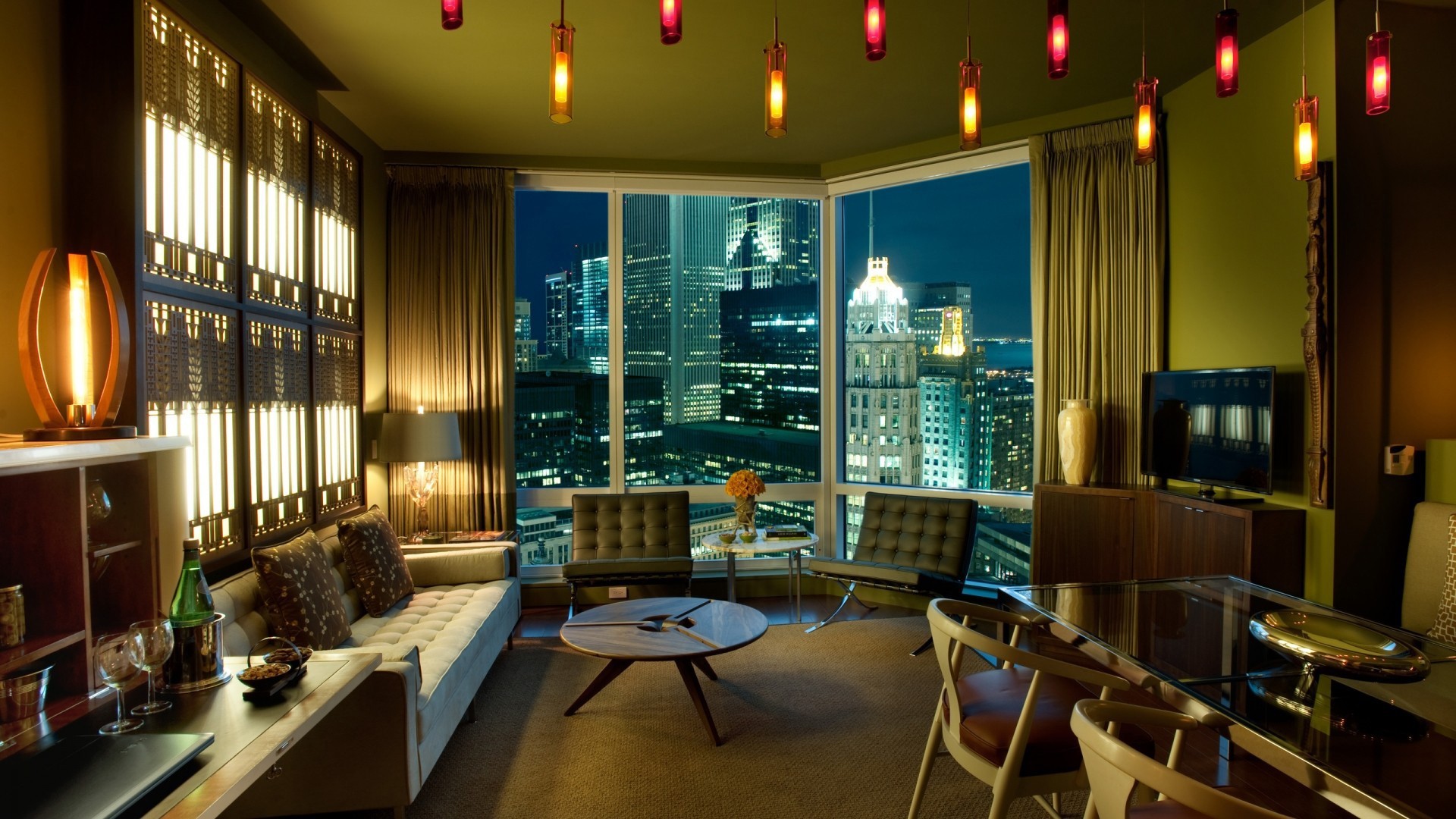 Luxury hotel room with a city view at night HD Wallpaper