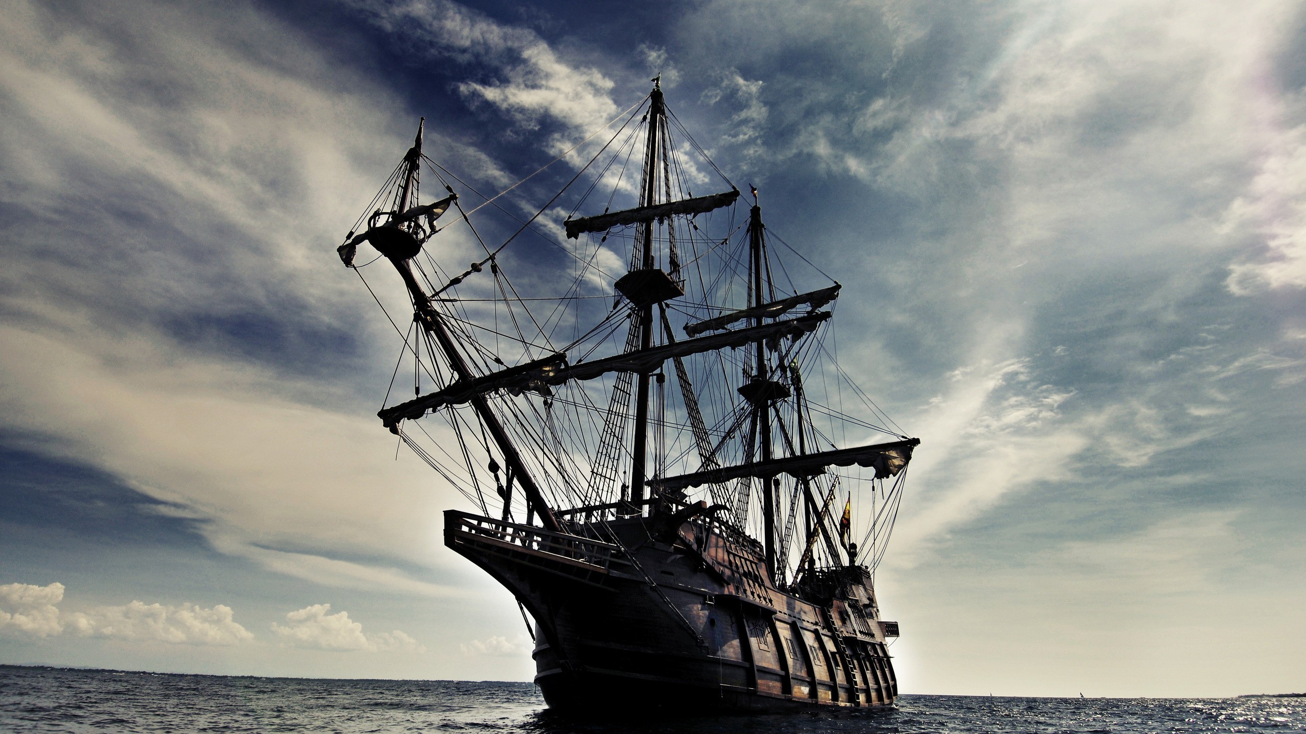 A large sailing ship on the ocean HD Wallpaper