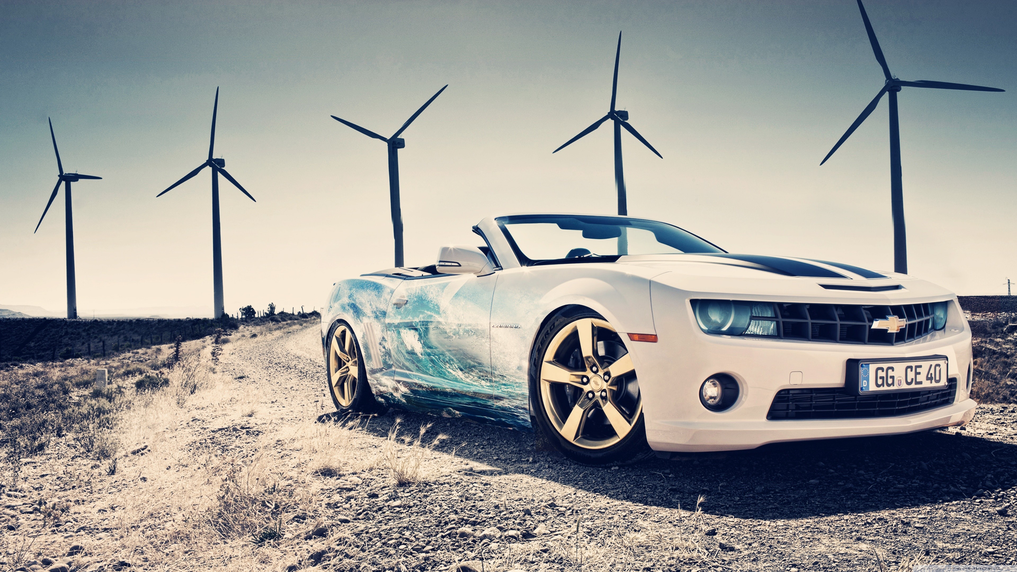 White Chevrolet Camaro convertible with wave graphic and wind turbines HD Wallpaper