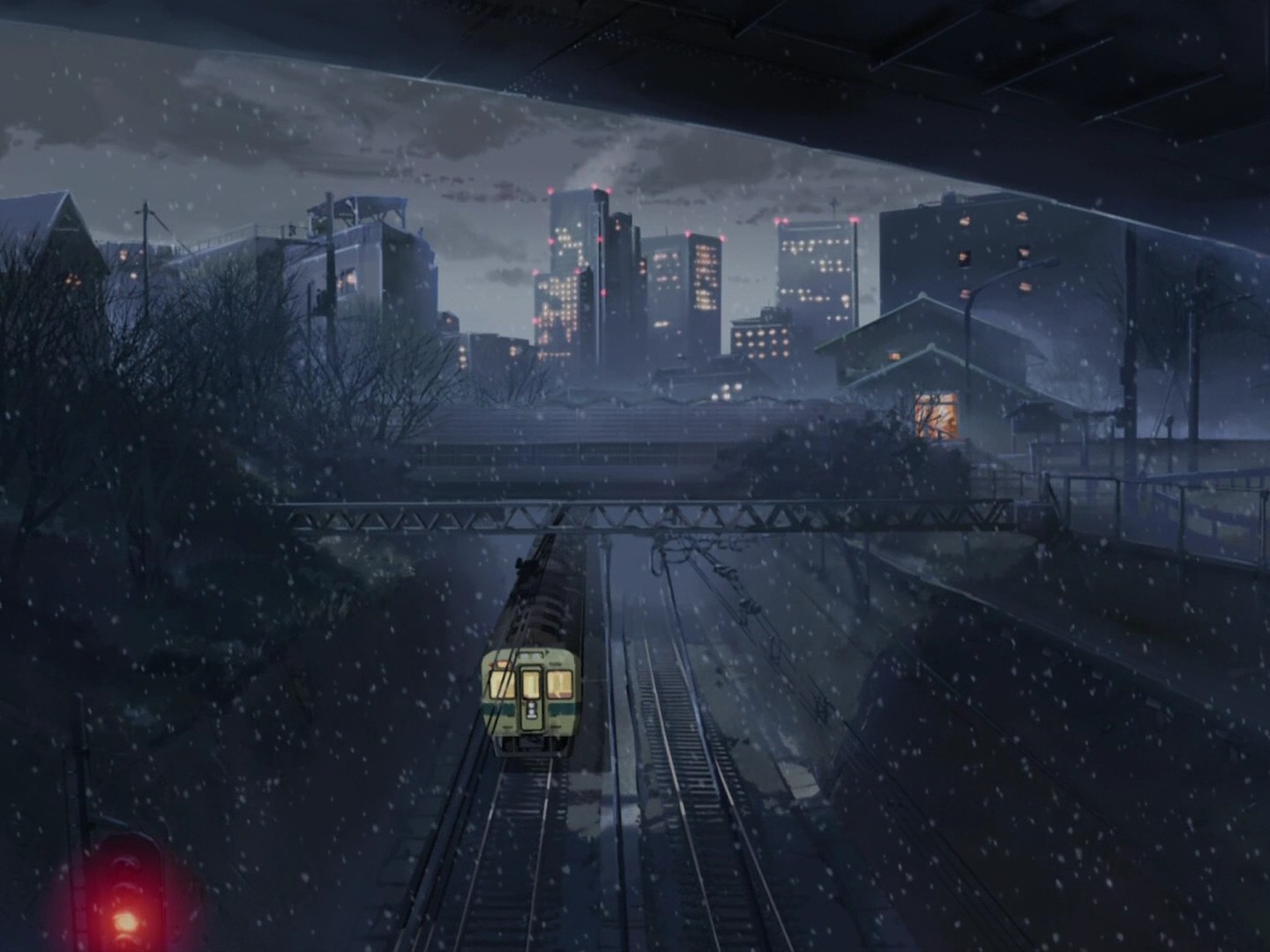 Train in a snowy city at night HD Wallpaper