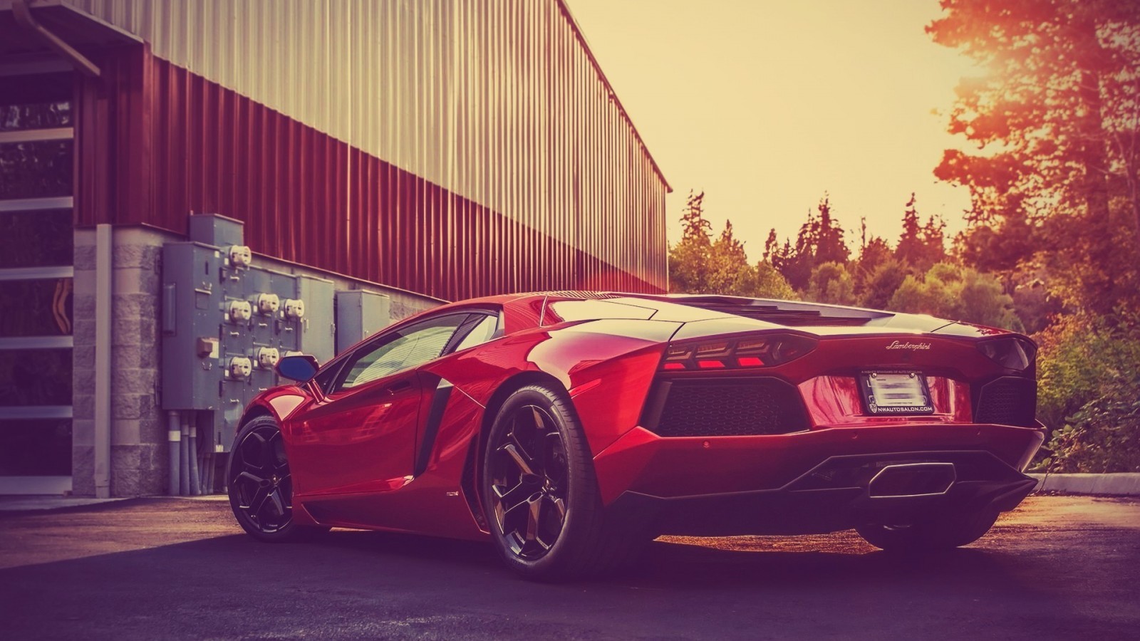 Red Lamborghini Aventador parked near a building HD Wallpaper