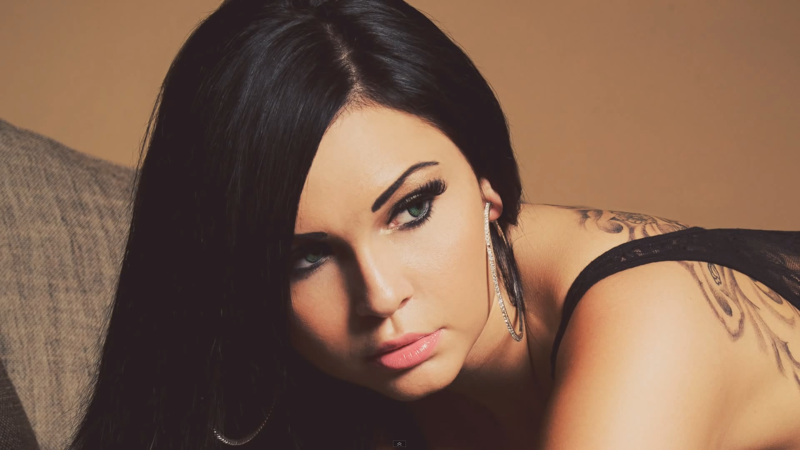 Woman with black hair and tattoos HD Wallpaper