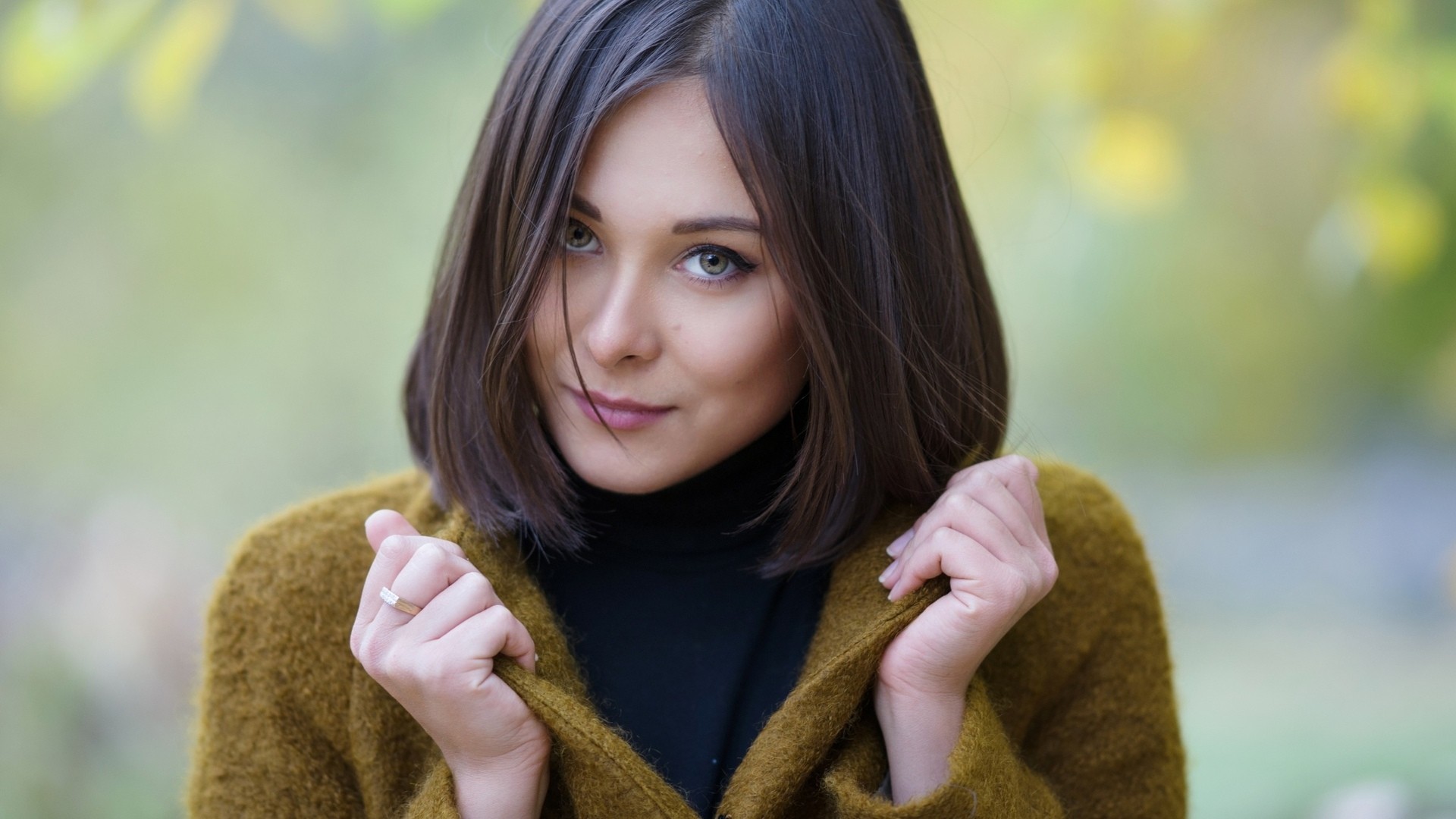 Woman with short brown hair wearing a mustard cardigan HD Wallpaper