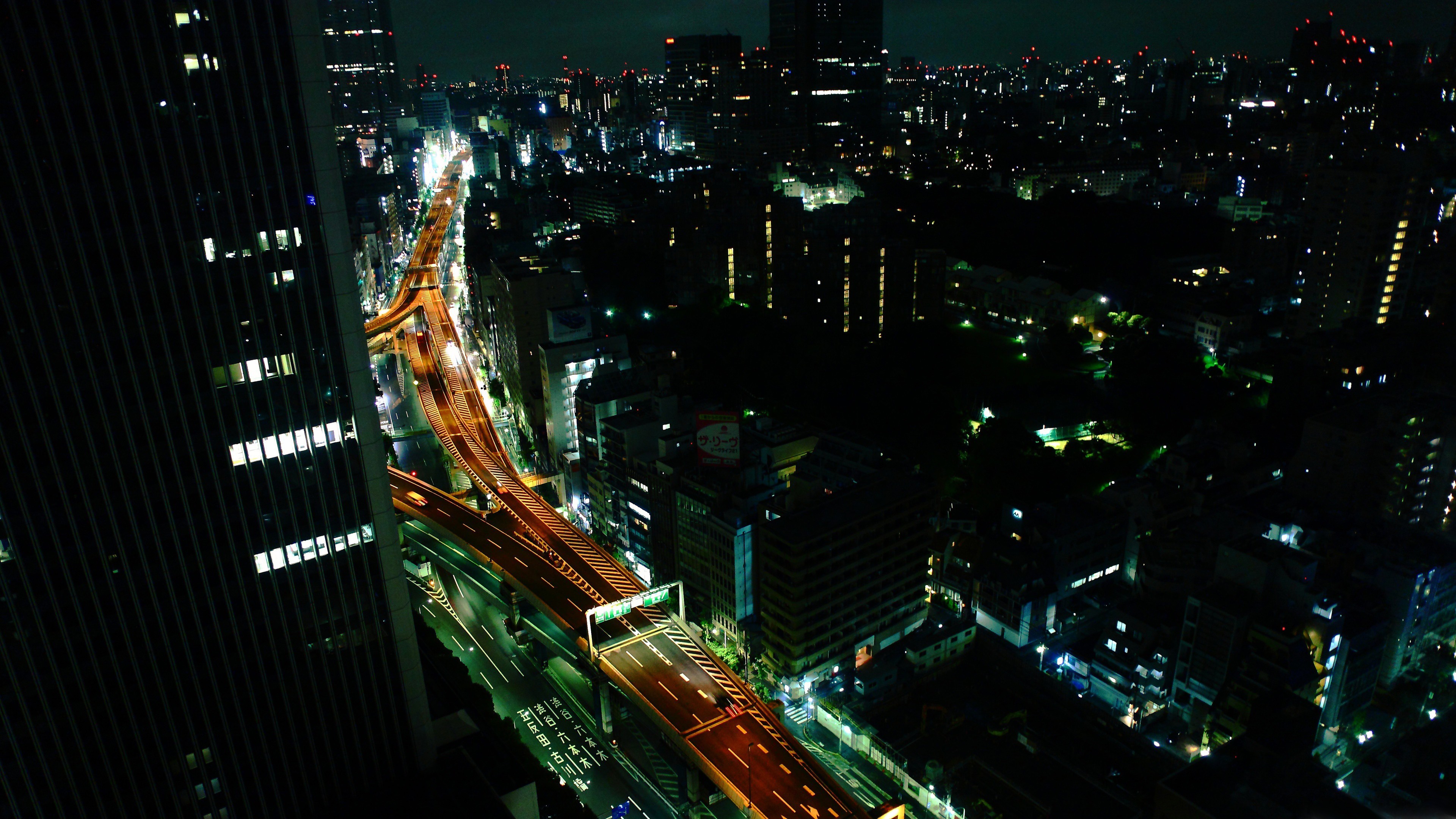 Tokyo cityscape at night with a highway HD Wallpaper