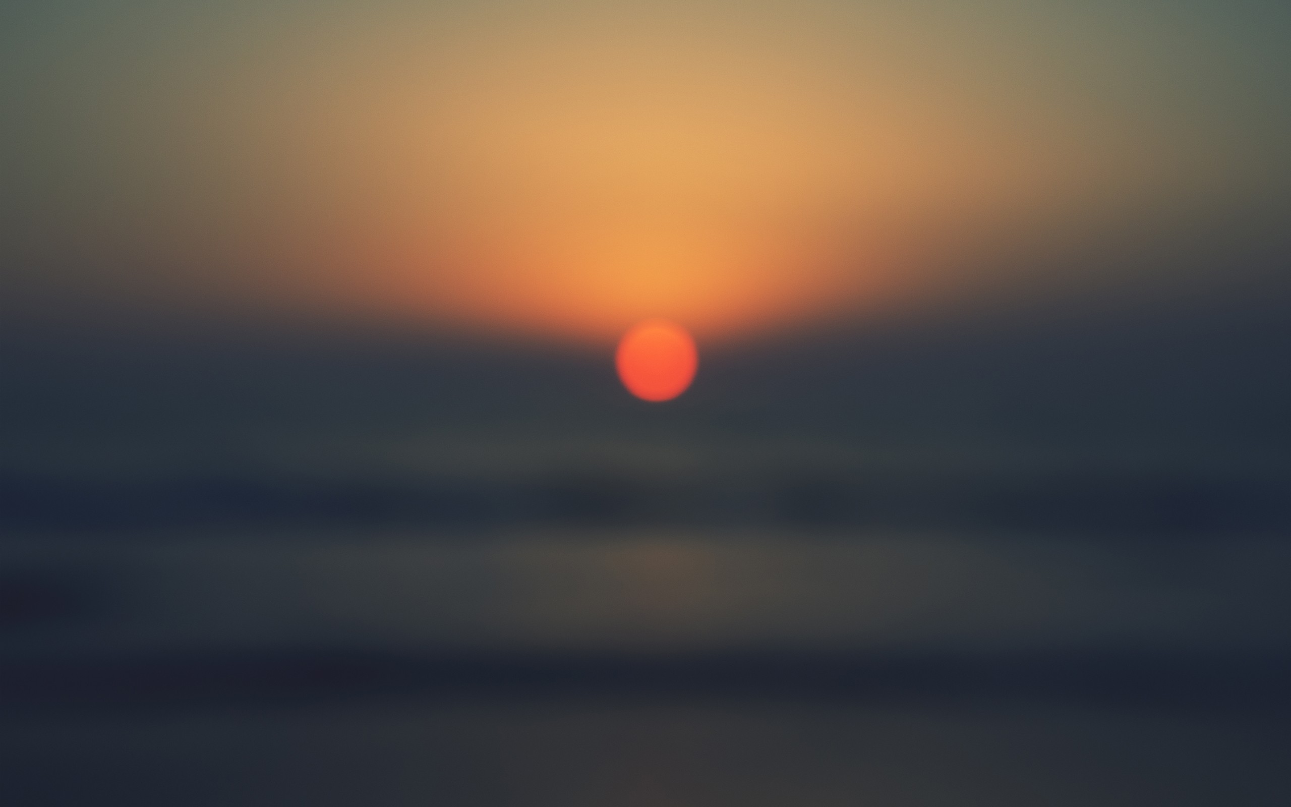 Sunset over the ocean with orange sun HD Wallpaper