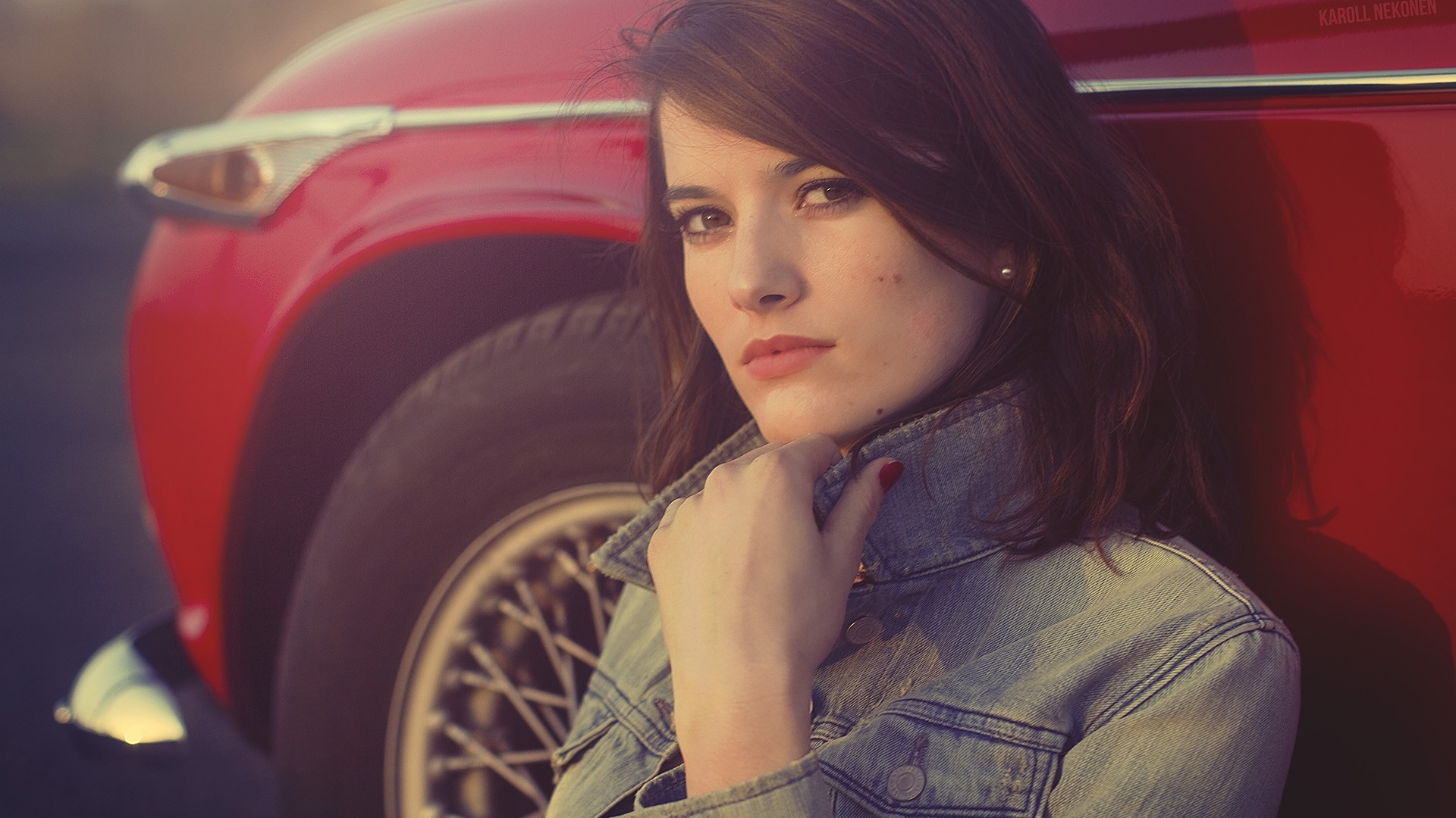 Woman leaning against a red vintage car HD Wallpaper