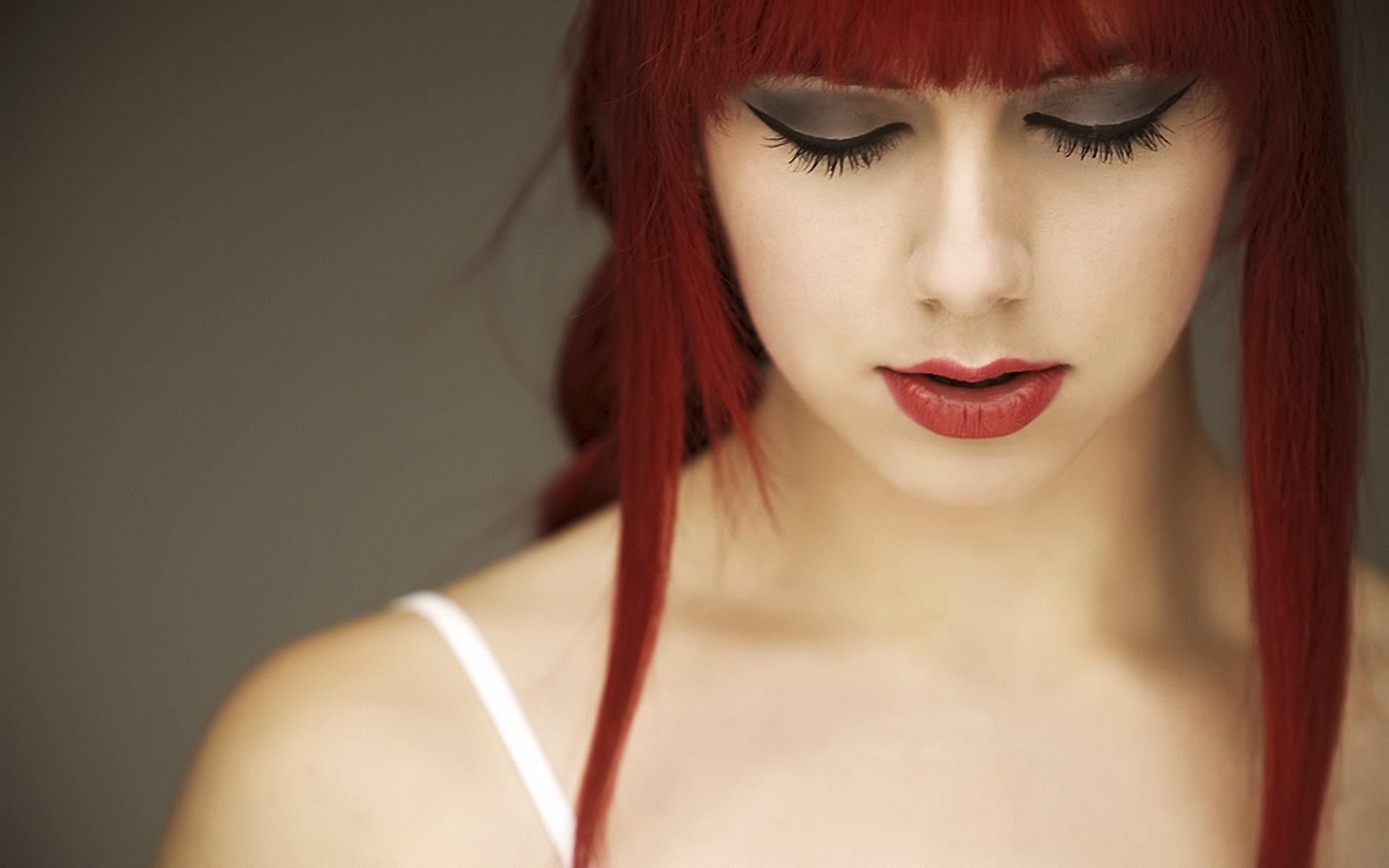 Woman with red hair and dramatic makeup HD Wallpaper