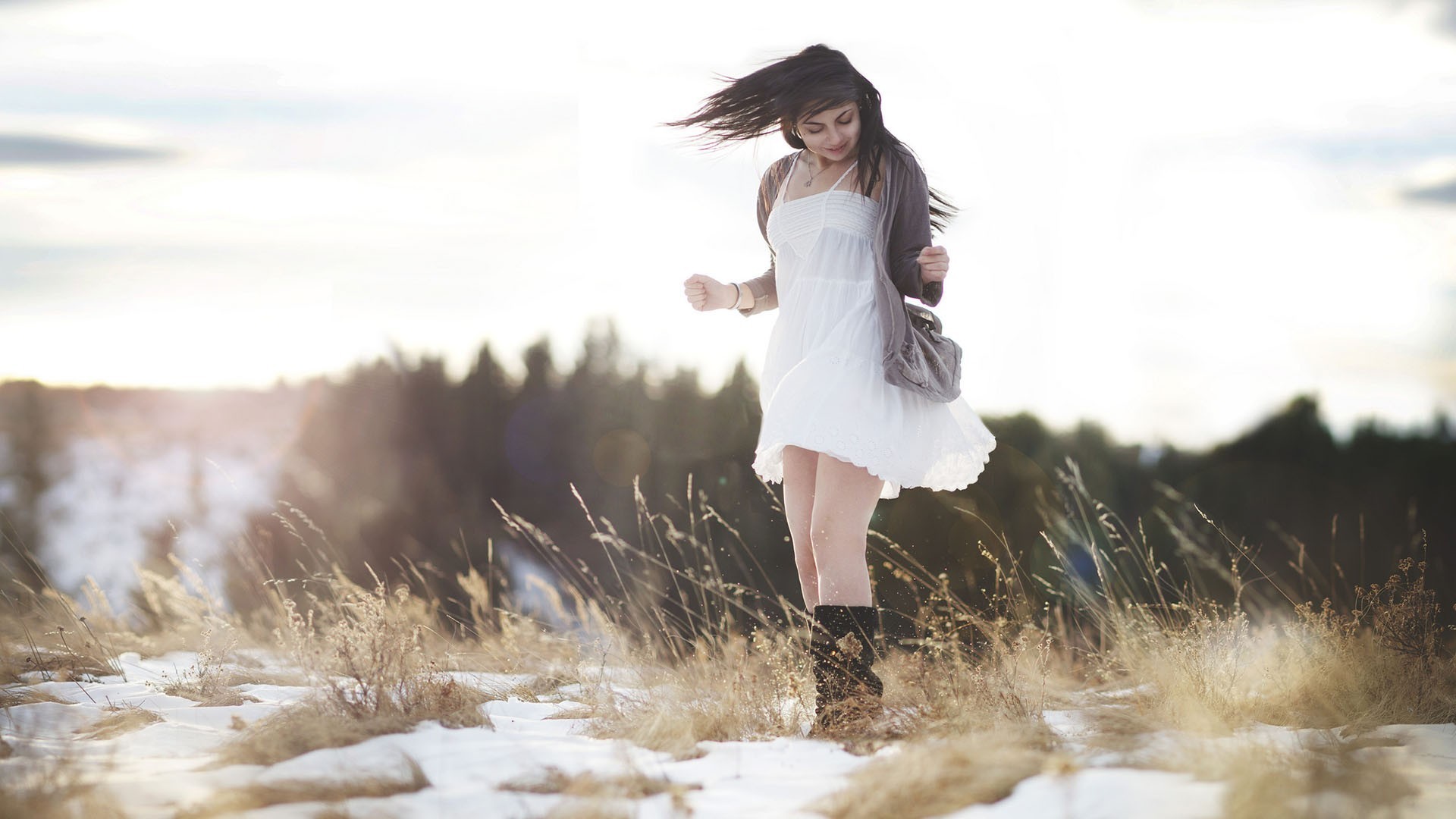 Woman in white dress in a snowy field HD Wallpaper