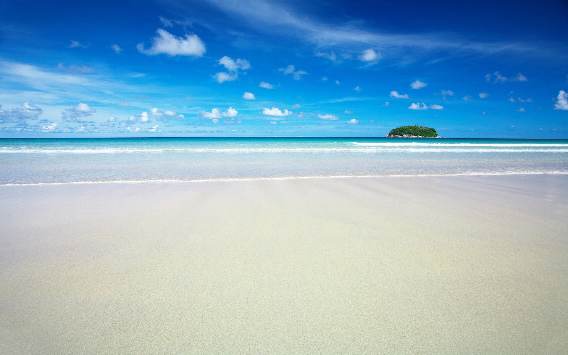 A tropical island in the sea with a sandy beach HD Wallpaper