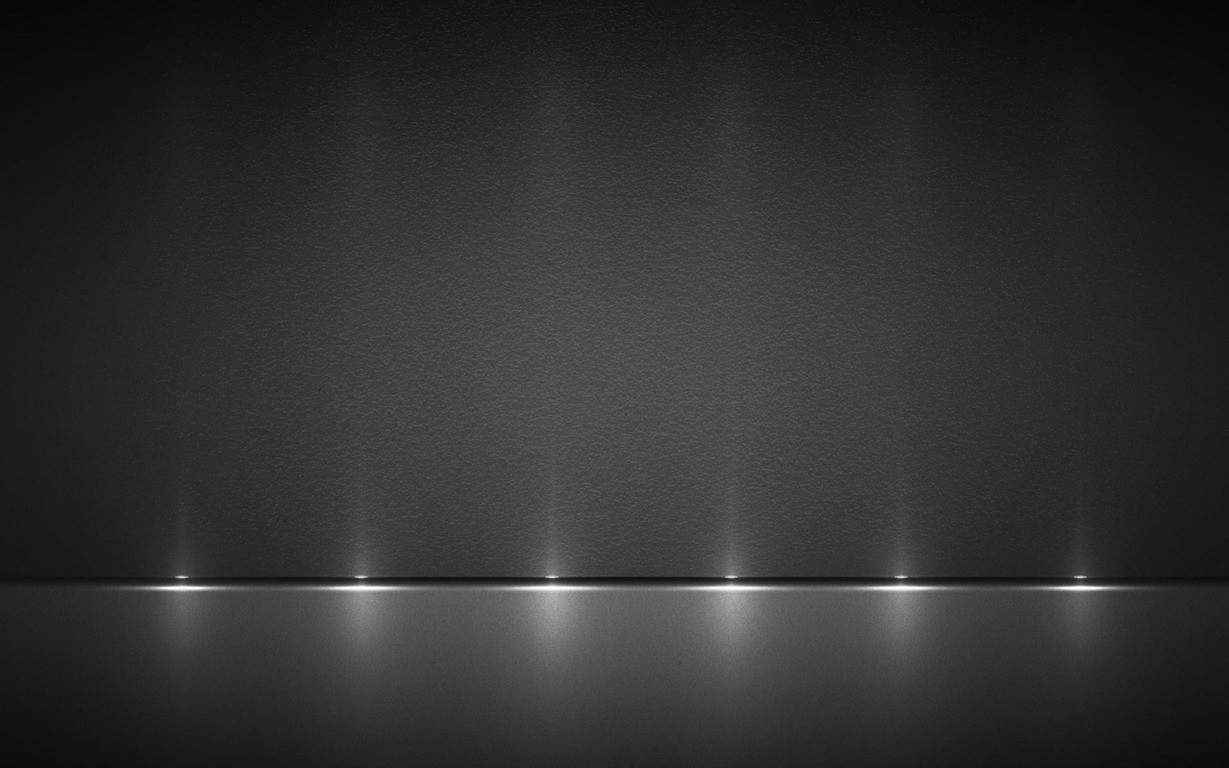 Dark textured wall with spotlights and reflective floor HD Wallpaper